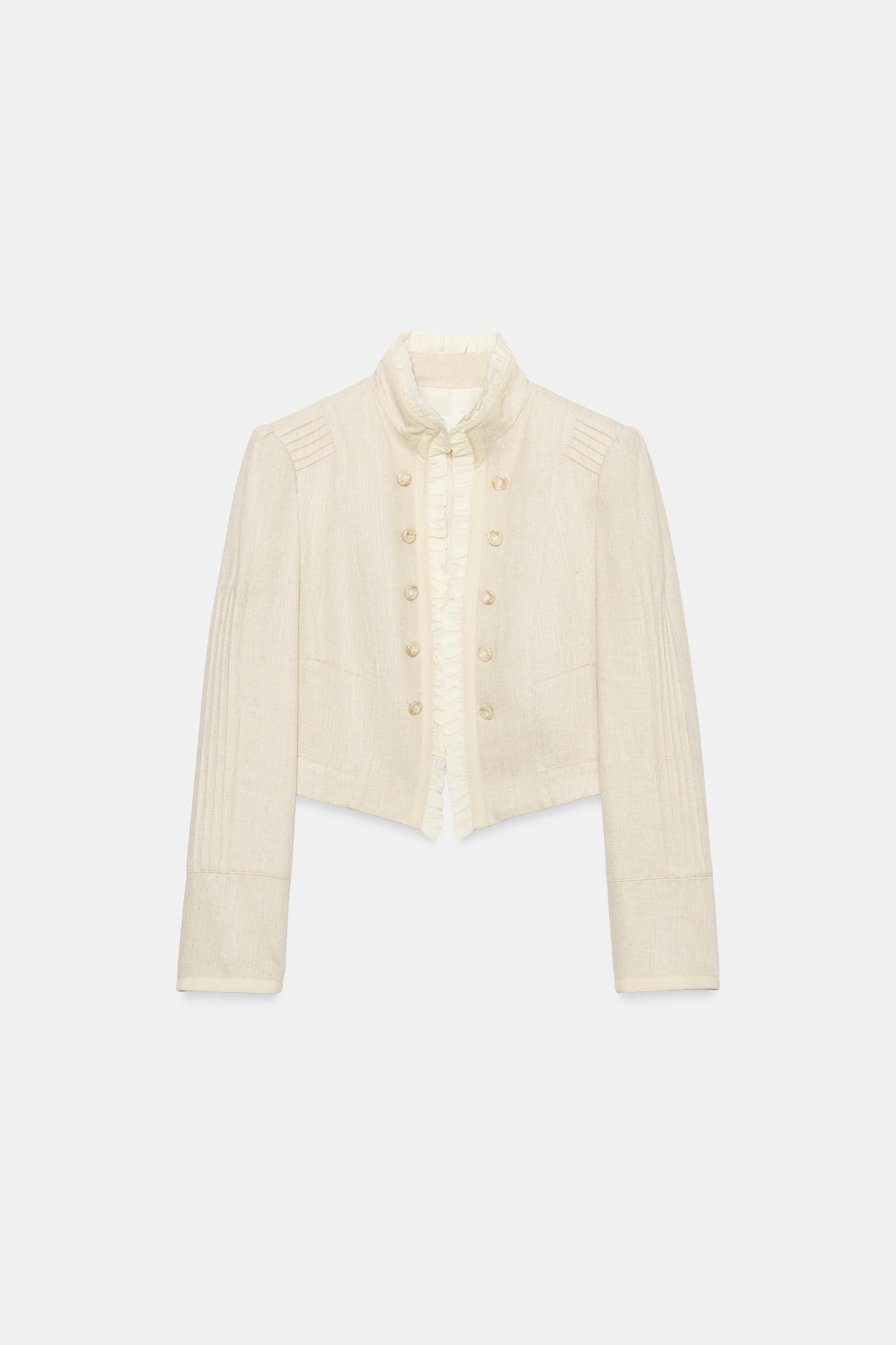 Model height: 178 cmOpen blazer featuring ruffles, long sleeves with shoulder pads and tuck detai... | Zara UK