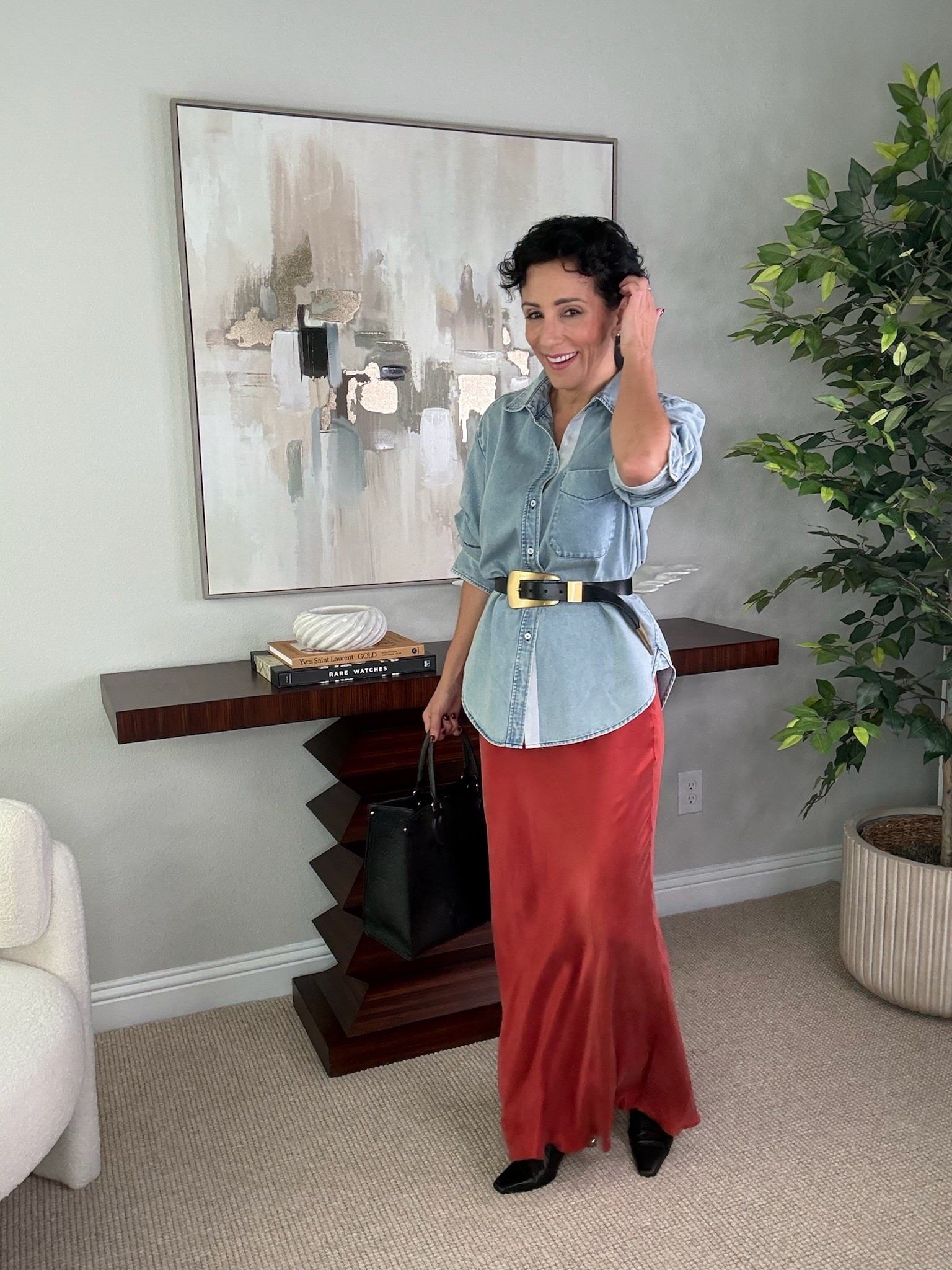 This denim and skirt combination is such a beautiful way to play with color. The relaxed chambray shirt balances the feminine shape of the skirt, while the black accessories bring the whole look together. A great example of mixing classic pieces with a statement color.

denim shirt outfit, satin skirt, red skirt outfit, fall outfit ideas, classic style, feminine style, elevated casual outfit, women over 50 style, timeless wardrobe, color combination, fall fashion, stylewitheugenia

#LTKootd #LTKOver40 #LTKSeasonal