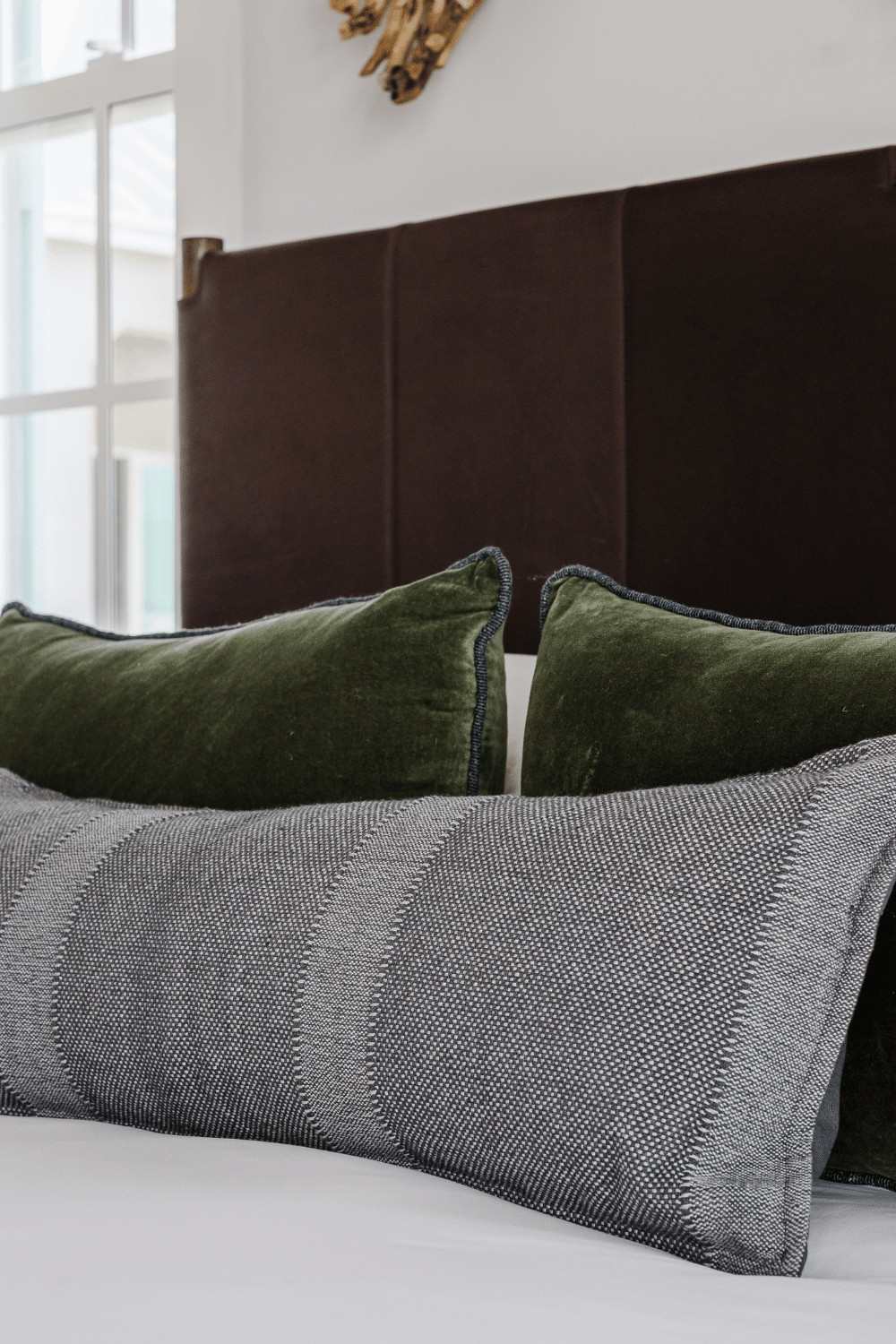 Pillows are the icing on the cake when it comes to a well styled bed, and honestly?  I've been finding great options on Wayfair for my projects lately.  These green velvet pillows with blue trim were PERFECT in this beach house master bedroom.

#bedroomdecor #throwpillows 

 #LTKHome