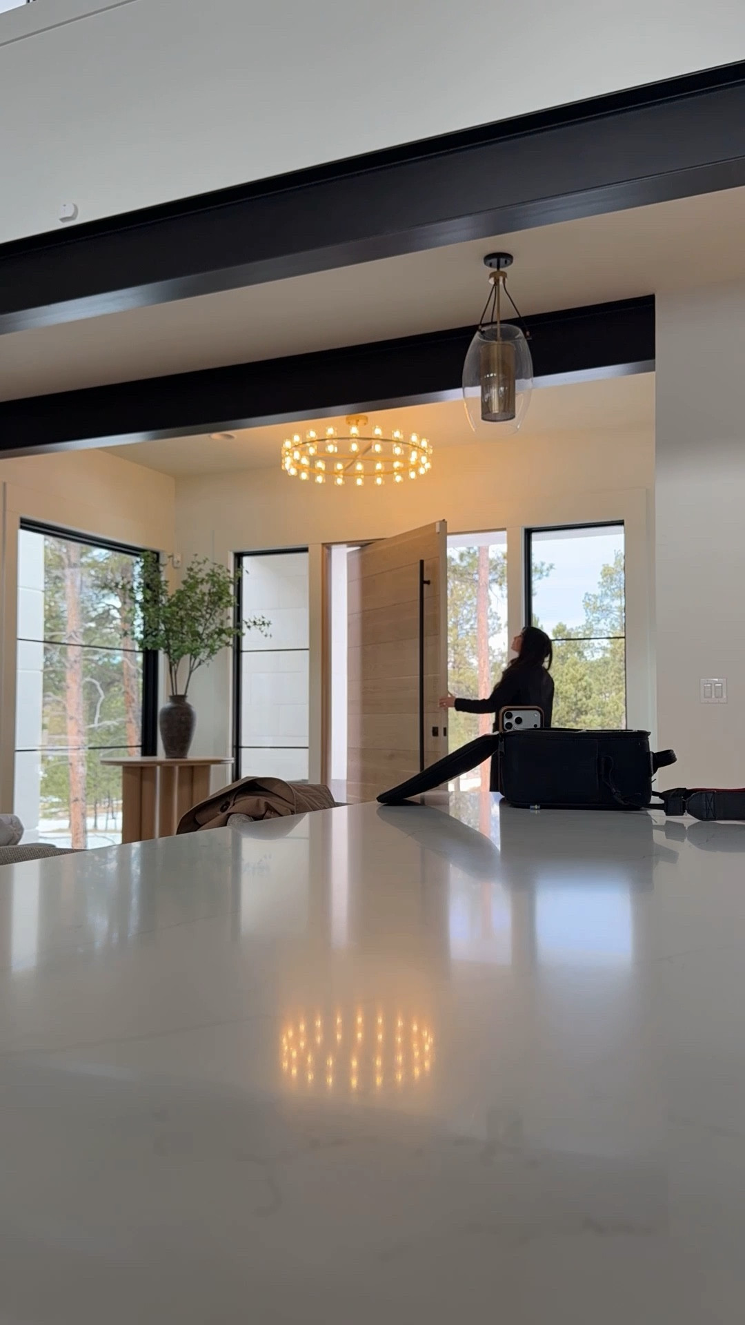 Behind the scenes of some content creation. Loving my new entryway light. This is the Sunrise Crystal Chandelier. Part of The Golden Hour Collection by my friend XiXi! Light details are on my IG. 

#LTKdayinmylife #LTKHome #LTKootd