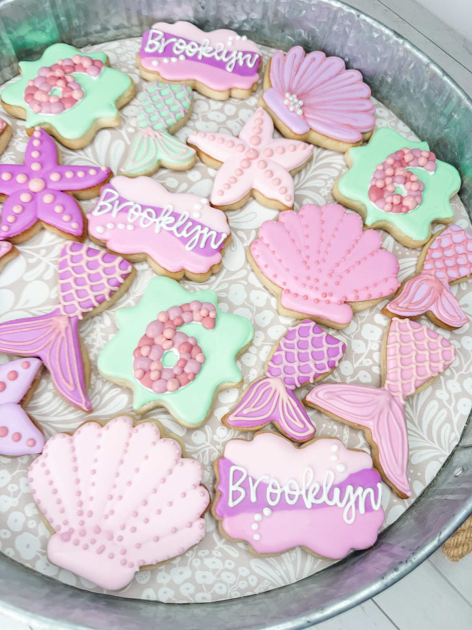 This mermaid cookie set is giving all the pastel under-the-sea birthday vibes. 🧜‍♀️ From seashells and starfish to mermaid tails, pearl details, and personalized name cookies, this set was such a fun way to bring a 6th birthday theme to life. Perfect for a dessert table, party favors, or a sweet custom treat for a little mermaid-loving birthday girl.

#LTKFamily #LTKKids #BirthdayCookies #MermaidBirthday #MermaidParty #UnderTheSeaParty #CustomCookies #SugarCookies #DecoratedCookies #CookieDecorating #BirthdayPartyIdeas #GirlsBirthdayParty #DessertTable #PartyInspo #KidsBirthdayParty 

 #LTKdayinmylife #LTKfoodie #LTKKids