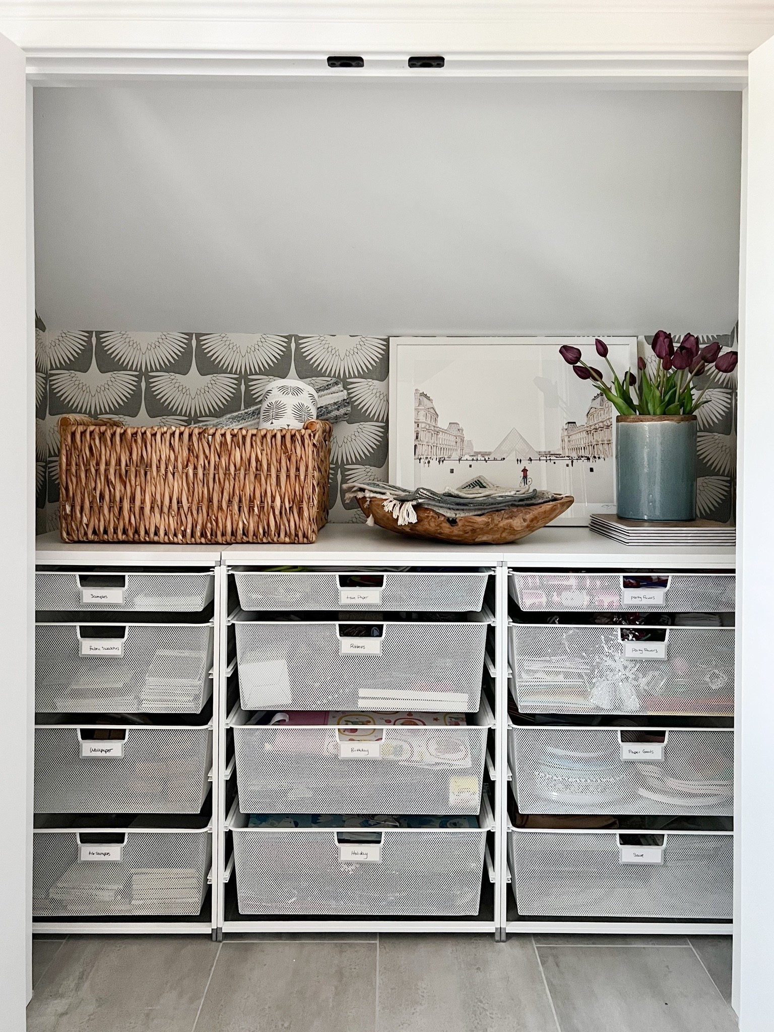 Proof that an organized closet can still be pretty. Labeled drawers keep everything easy to find, while wallpaper, woven storage, art, and flowers make a hardworking space feel intentional.

closet organization, organized closet, storage ideas, home organization, closet storage, labeled storage, small space organization, wallpaper, woven baskets, girlonthehudson

#LTKHome #LTKdayinmylife #LTKSeasonal