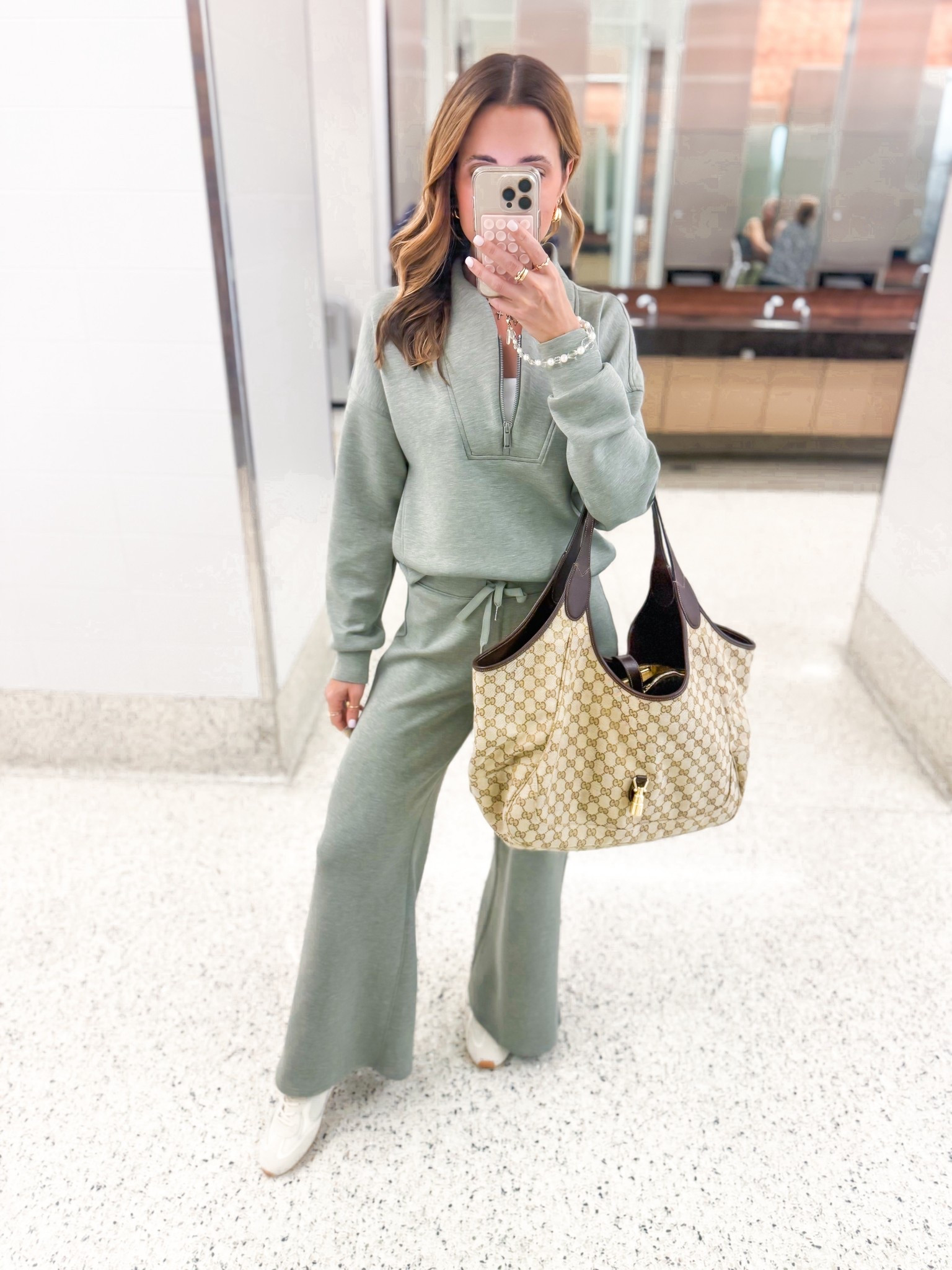 My travel outfit of the day! The best matching set in XS petite pants/XS in top. Airport outfit. Gucci Mercato tote large. Tory Burch field sneakers - i went up half a size. LISAMARIEXSPANX for 15% off first order & free shipping.

#LTKdayinmylife #LTKootd #LTKTravel