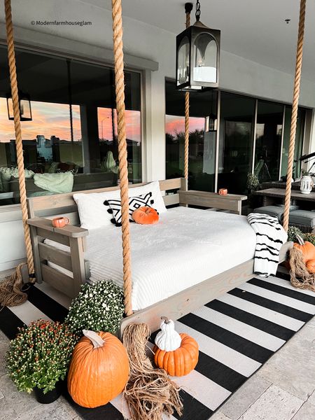 Fall DIY Porch Swing at Modern Farmhouse Glam. 
The best faux pumpkins, black and white, striped outdoor rug, white, blanket, pillows, home decor, nautical rope  Halloween  outdoor lantern  Wayfair, Pottery Barn, Amazon, target 

#LTKSeasonal #LTKhome #LTKHoliday