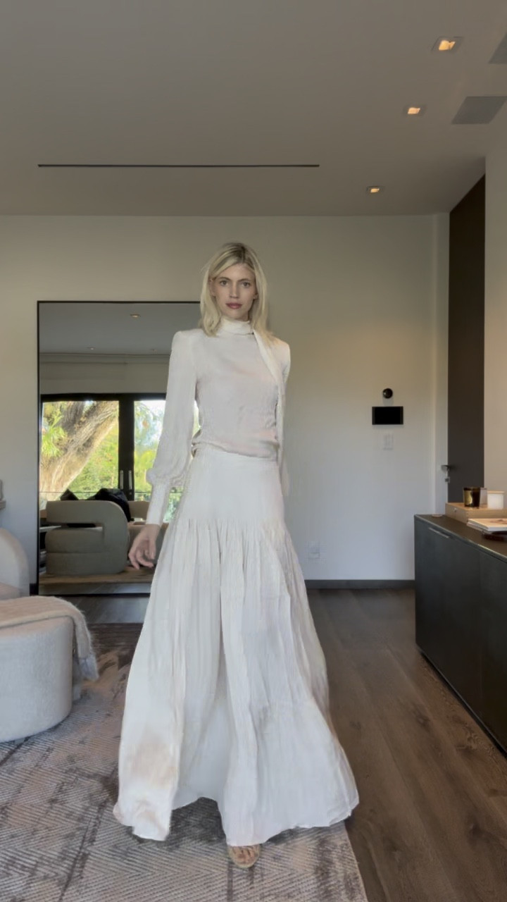 This skirt is so easy breezy! It is lightweight and versatile ✨☁️ Also obsessed with this top and the shoulder pads. 

#LTKWatchNow #LTKStyleTip