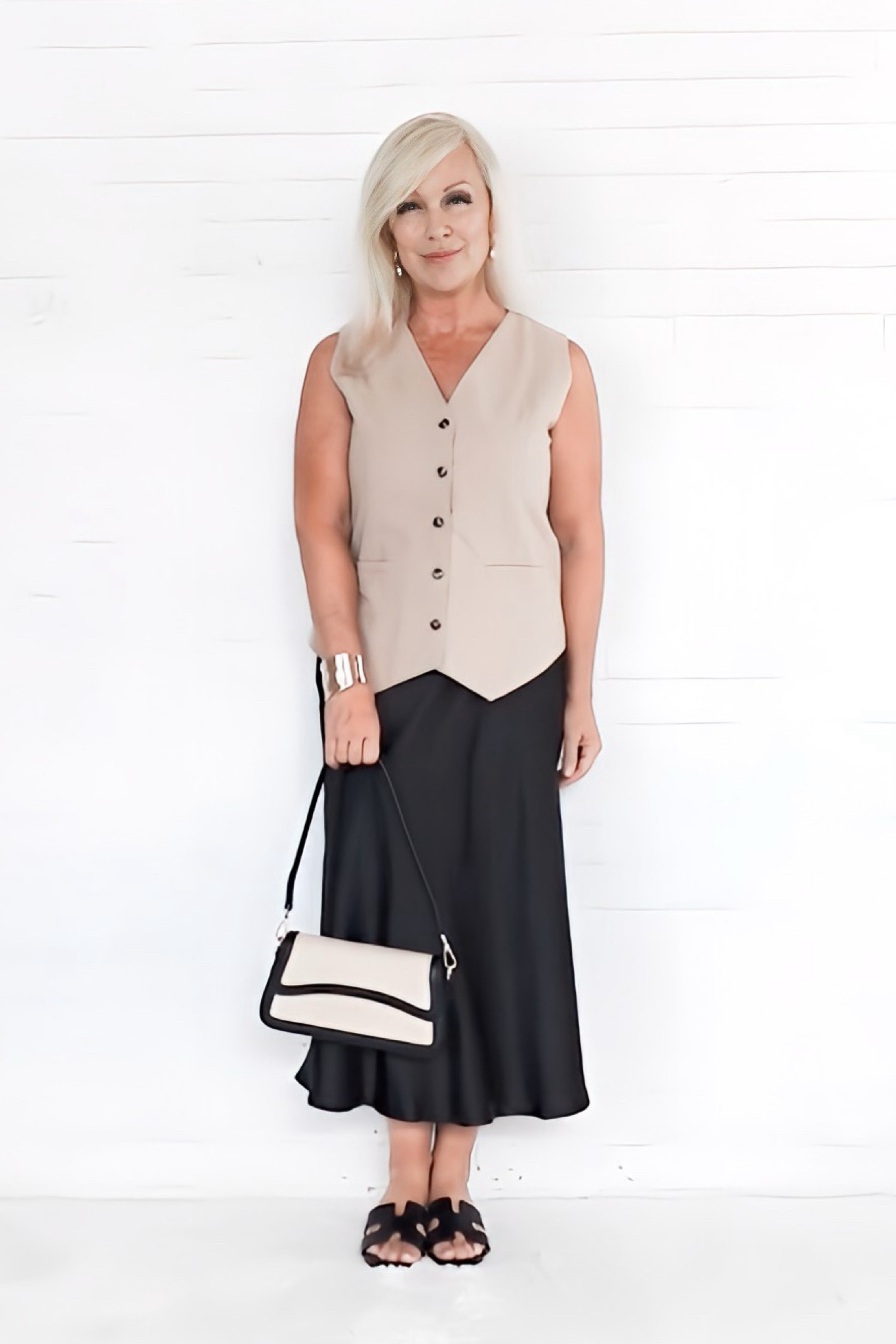 Instantly modernize your style by adding a vest to your wardrobe. Here, I have paired it with a satin slip skirt for an elevated summer outfit.

#LTKOver40 #LTKStyleTip #LTKFindsUnder50