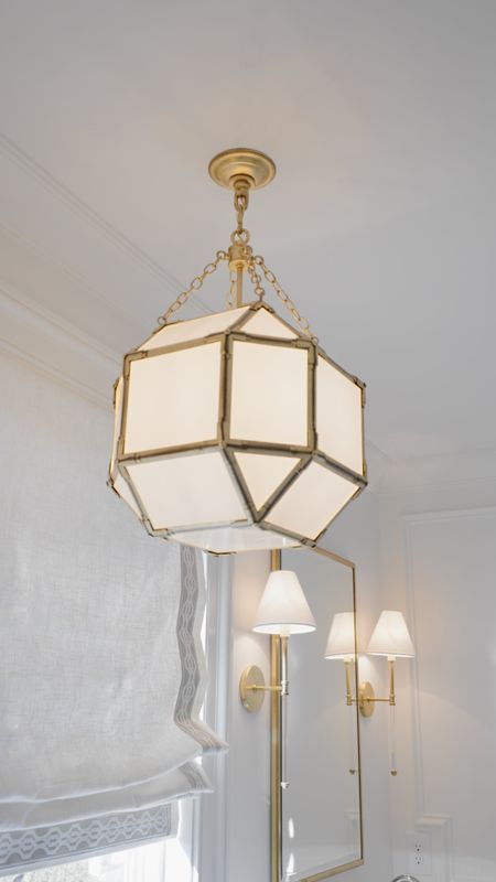 Bathroom lighting at the flip was a huge focus. I loved the warm finish of the brass and this pendant in the primary bathroom 

#LTKhome