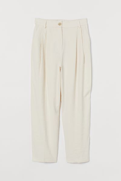 Ankle-length pants in viscose-blend twill with a high waist. Elastic at back of waistband, pleats... | H&M (US)