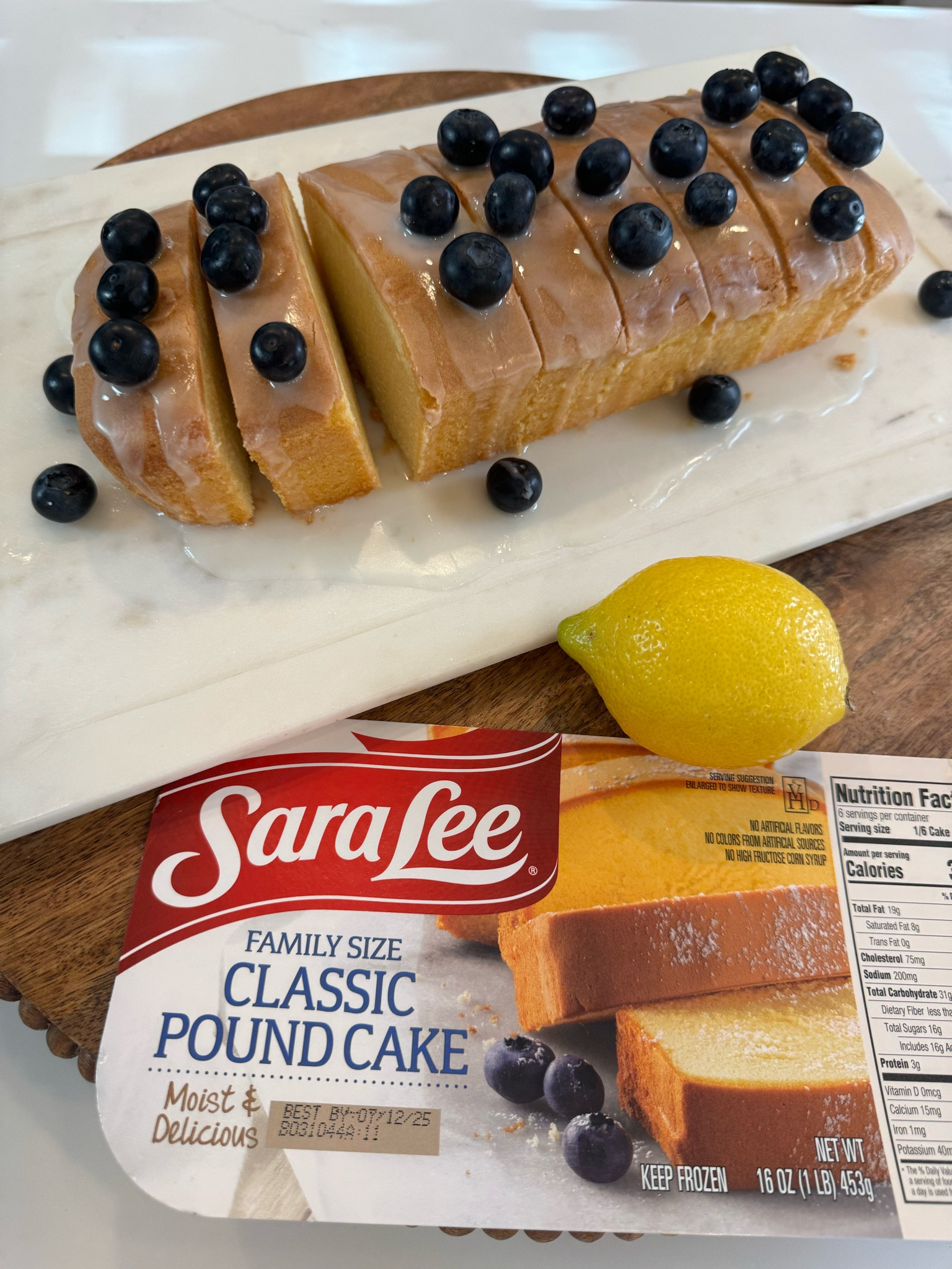 Sara Lee Pound Cake is on rollback at Walmart right now!  I always make sure to have at least one stashed away in my freezer.  I made a simple lemon glaze and topped with fresh blueberries.  It really took it to the next level! #SummerDessert #LemonBlueberry #SimpleDessert 

#LTKxWalmart #LTKParties #LTKFamily