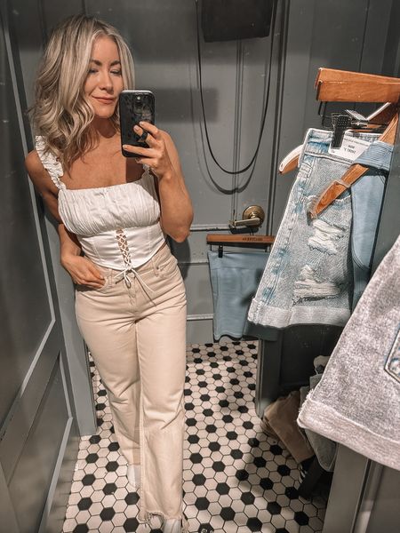 White cropped satin lace-up ruffle top, high rise cream relaxed straight leg jeans, Hollister look, Social Tourist, Spring look

#LTKstyletip #LTKU #LTKSeasonal