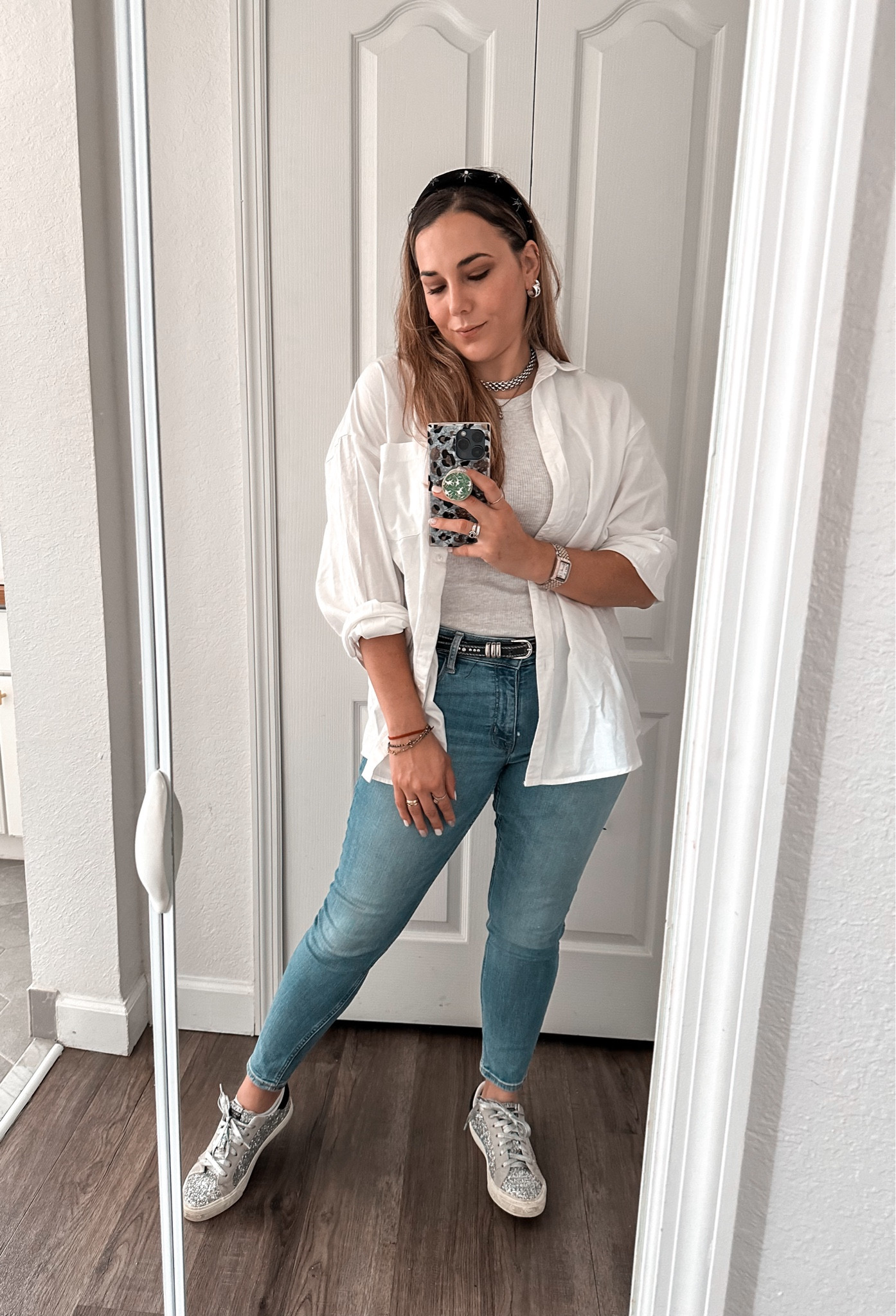Effortlessly chic and practical outfit for today 🩷

This look is perfect for transitioning weather in Miami – a light, breathable shirt over a comfy tank, paired with high-waisted skinny jeans for a flattering fit. The glitter sneakers add a fun touch while keeping it functional for chasing around my little one.

#LTKFindsUnder50 #LTKStyleTip #LTKTravel