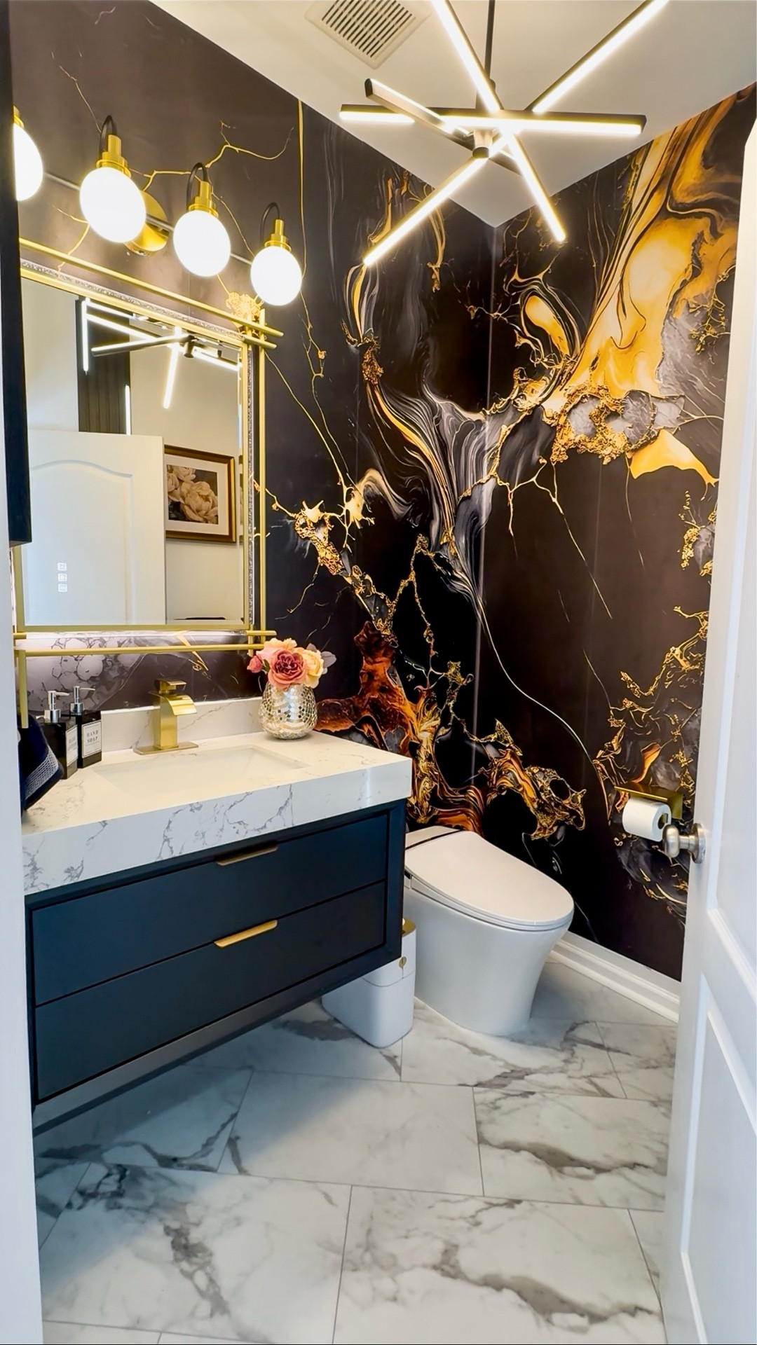 If you saw the stories about this bathroom Reno, you would tell I was so so happy about this project. Seeing how it came together really proves the power of a good Wallpaper 🙌
My mirror, vanity, toilet and light from @Allsumhome added that luxury touch and I couldn't be happier 💃

Home | Home decor |Entryway decor | Entryway table | console table | Buffet table | Accent table
Pottery barn | Amazon home
Restoration hardware look for less |Luxe for less | Entryway ideas | Foyer table | Foyer decor | Sofa table | Black sofa table | Black console | Black accent table
| Black wooden table |Living room decor | Rugs | Area rug | Neutral rug | Living room family room rug | Sofa sectional | Washable cleanable sofa | Family friendly sofa furniture | Stain resistant fabric sofa | Cloud sofa | Family kid toddler | pet friendly sofa | Coffee table | Livingroom | Home decor | bedding | bedroom | fall decor |  fall porch | dresser | rug | kitchen | dispenser | cutlery set | knives 


#LTKU #LTKHome #LTKFindsUnder100