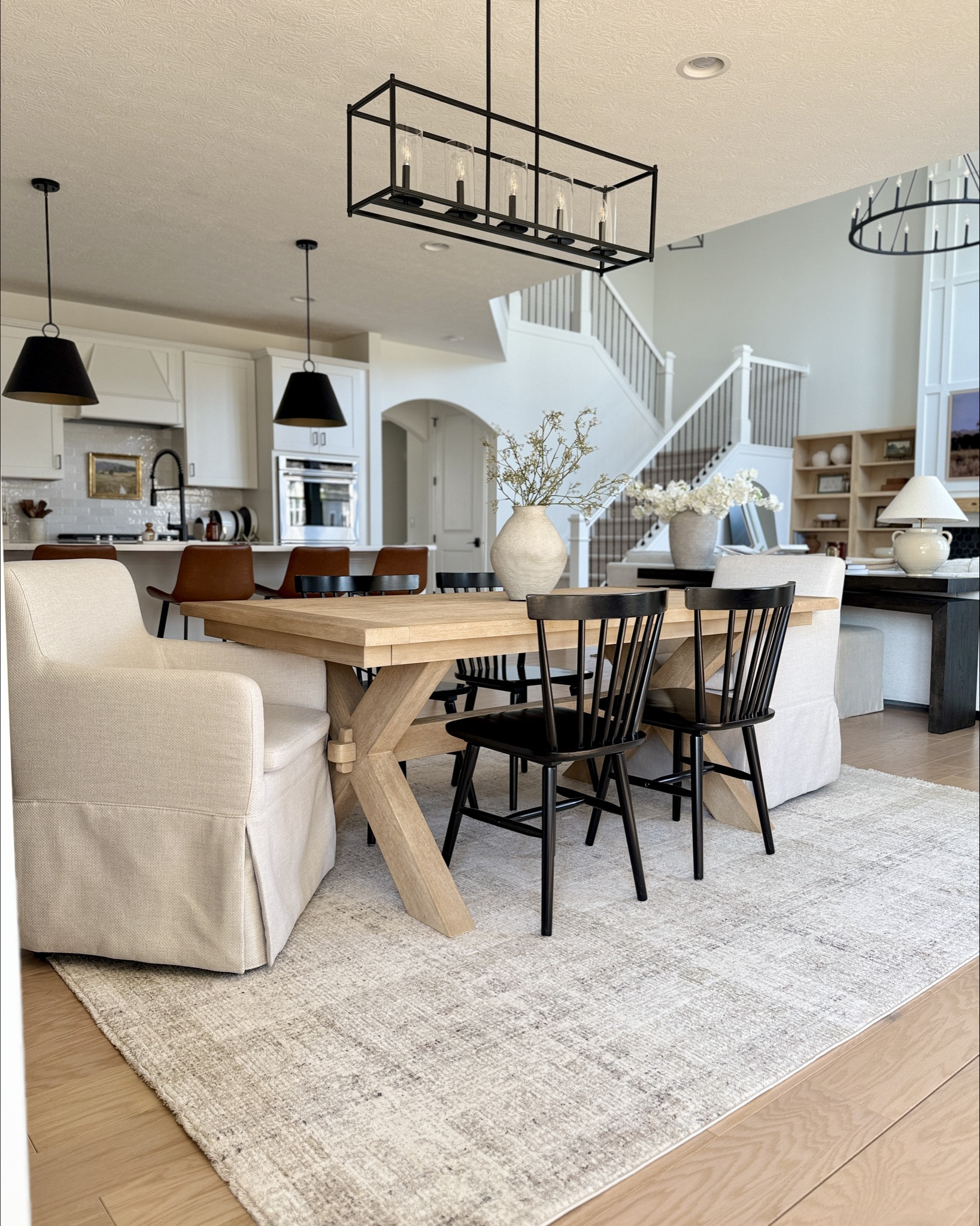 Open Concept Dining Space 

my black pendant lights are in stock! use my code: AROSS10OFF for 10% off thru 4/18/25! 

breakfast nook, eat in dining, dining room, open concept living, spring refresh 

#LTKHome #LTKSaleAlert #LTKFindsUnder100
