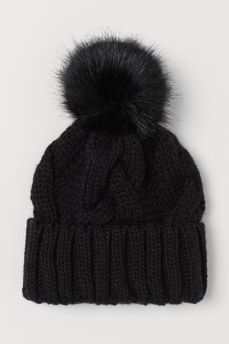Soft, cable-knit hat with a faux fur pompom at top. Sewn, foldover cuff. | H&M (US)