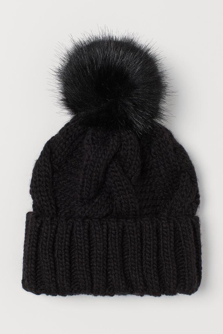 Soft, cable-knit hat with a faux fur pompom at top. Sewn, foldover cuff. | H&M (US + CA)