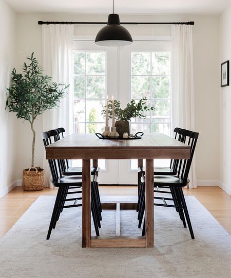 Simple fall dining room, dining room rug, black dining chairs, faux olive tree, farmhouse table, centerpiece, candlesticks, candle holders 

#LTKSeasonal #LTKhome #LTKstyletip
