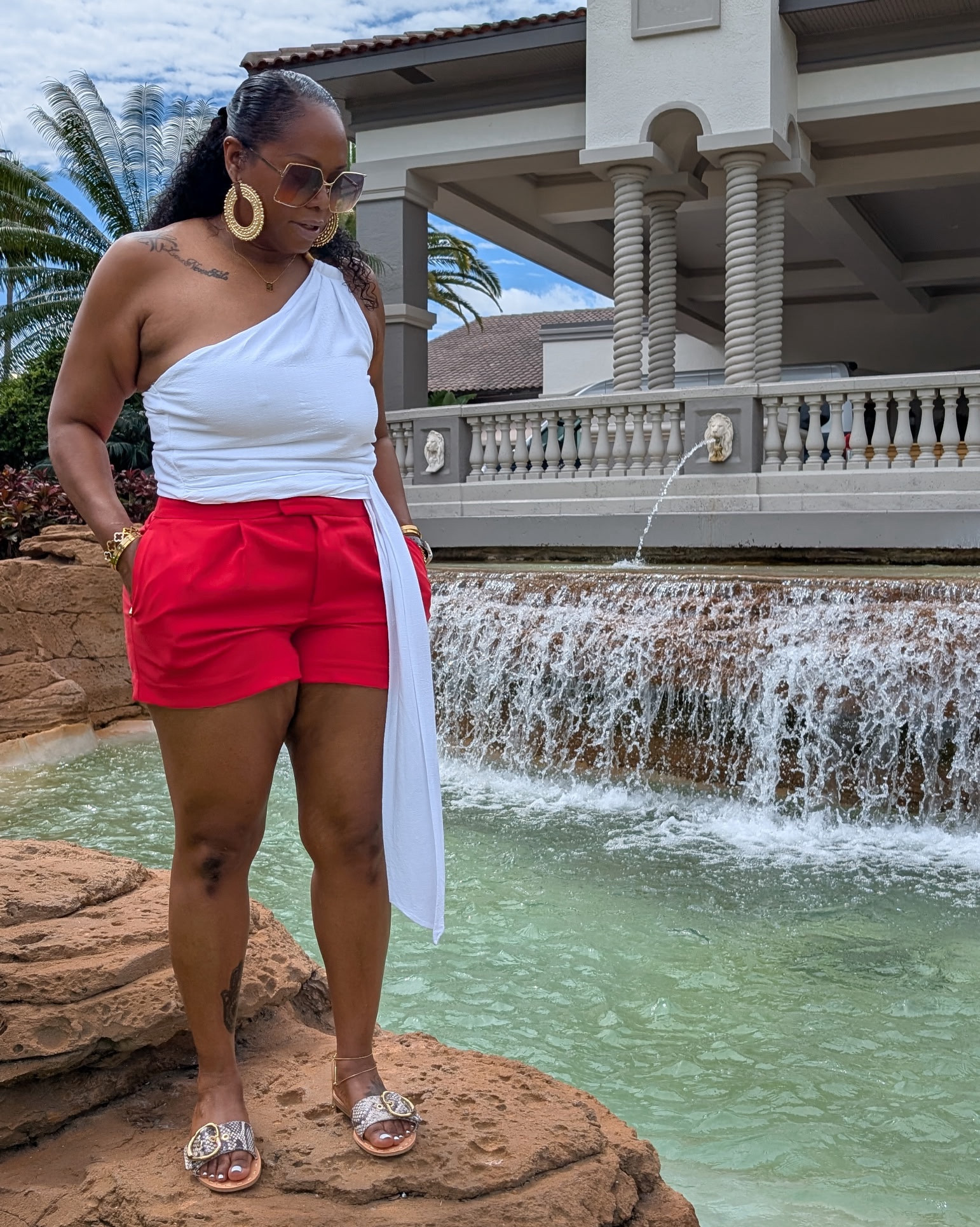 Easy resort vibe today. One-shoulder top, red tailored shorts, gold slides. Breezy, bright, brunch ready, sis.

Asymmetrical top L | Shorts 10 | Snakeskin sandals | Gold accessories 

Soft life, styled right. ✨

#fabulouslychic #effortlessstyle #fashioninfluencer #atlfashioninfluencer #fashioninspo #luxelife #imtashamack

#LTKPlusSize #LTKOver40 #LTKFindsUnder50