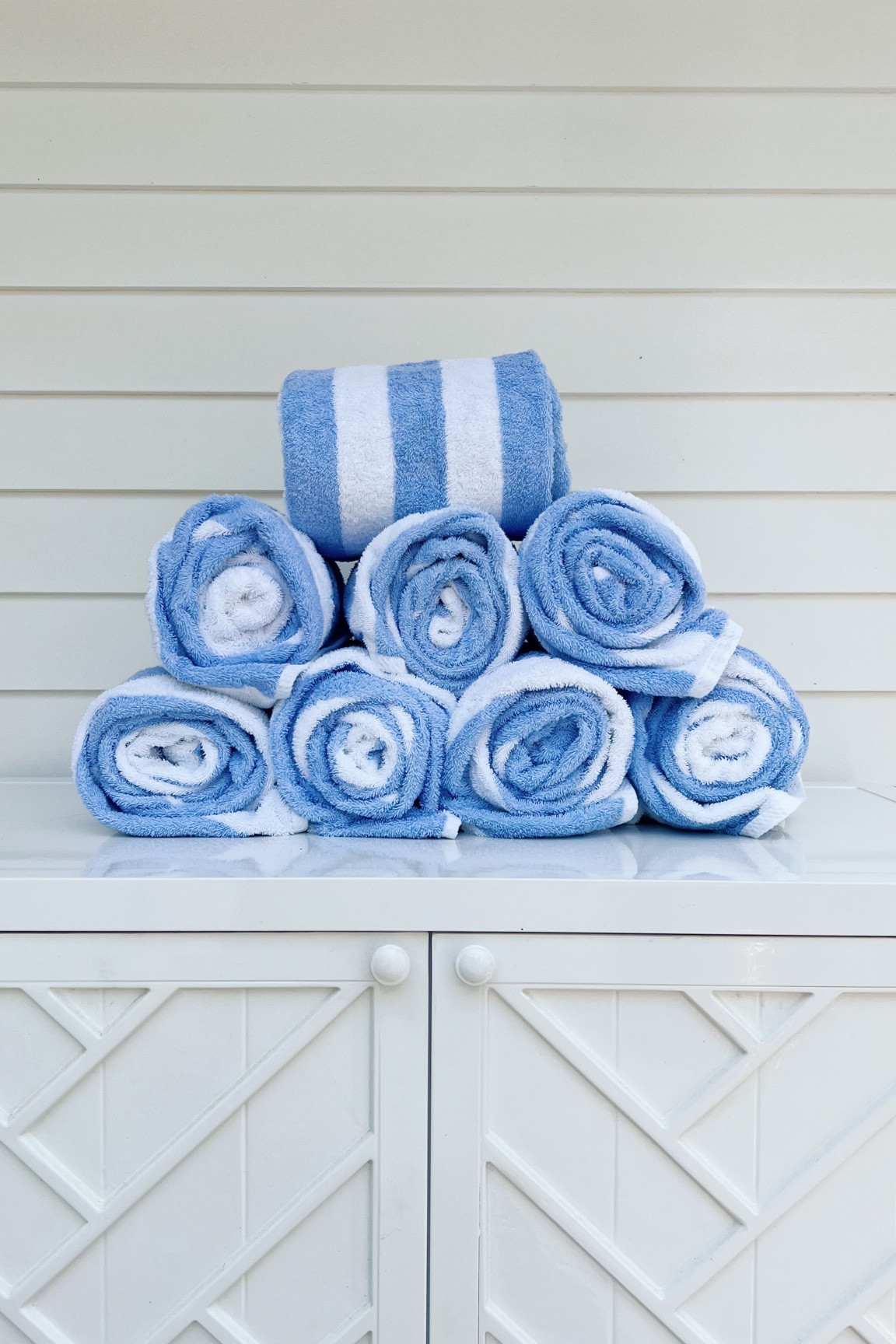 Striped pool towels on our outdoor console 💙 

#LTKunder50 #LTKhome #LTKFind