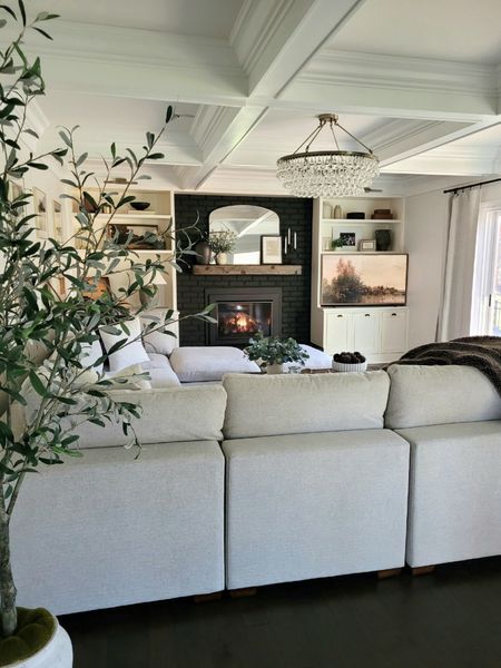 Living room inspo, family room inspo, sectional, fireplace,  built ins,  shelf styling,  shelf decor,  arch mirror

#LTKhome