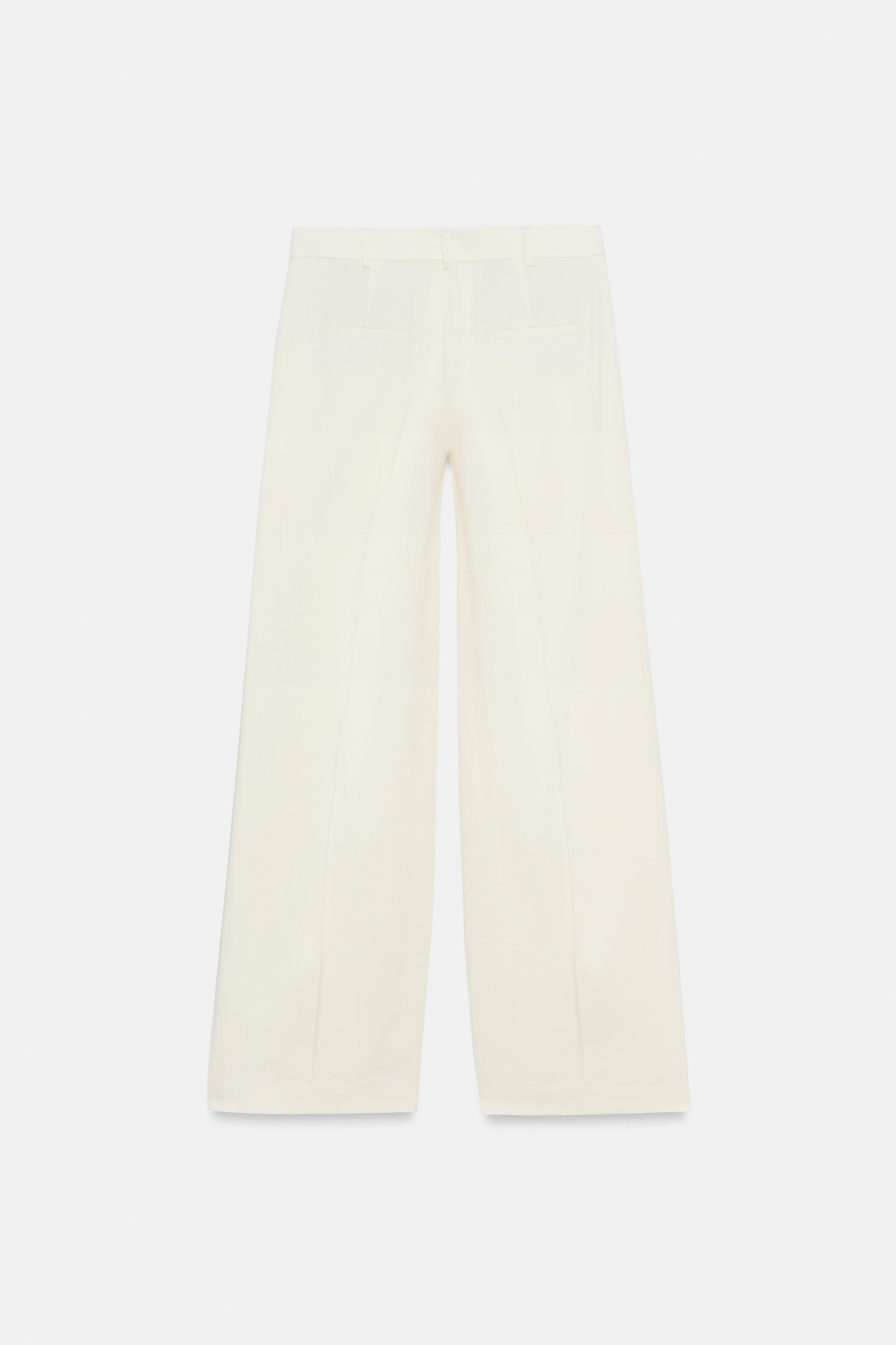 ZARA WOMAN COLLECTIONTrousers made from a 38% cotton blend yarn. Mid-waist with belt loops. Side ... | Zara UK