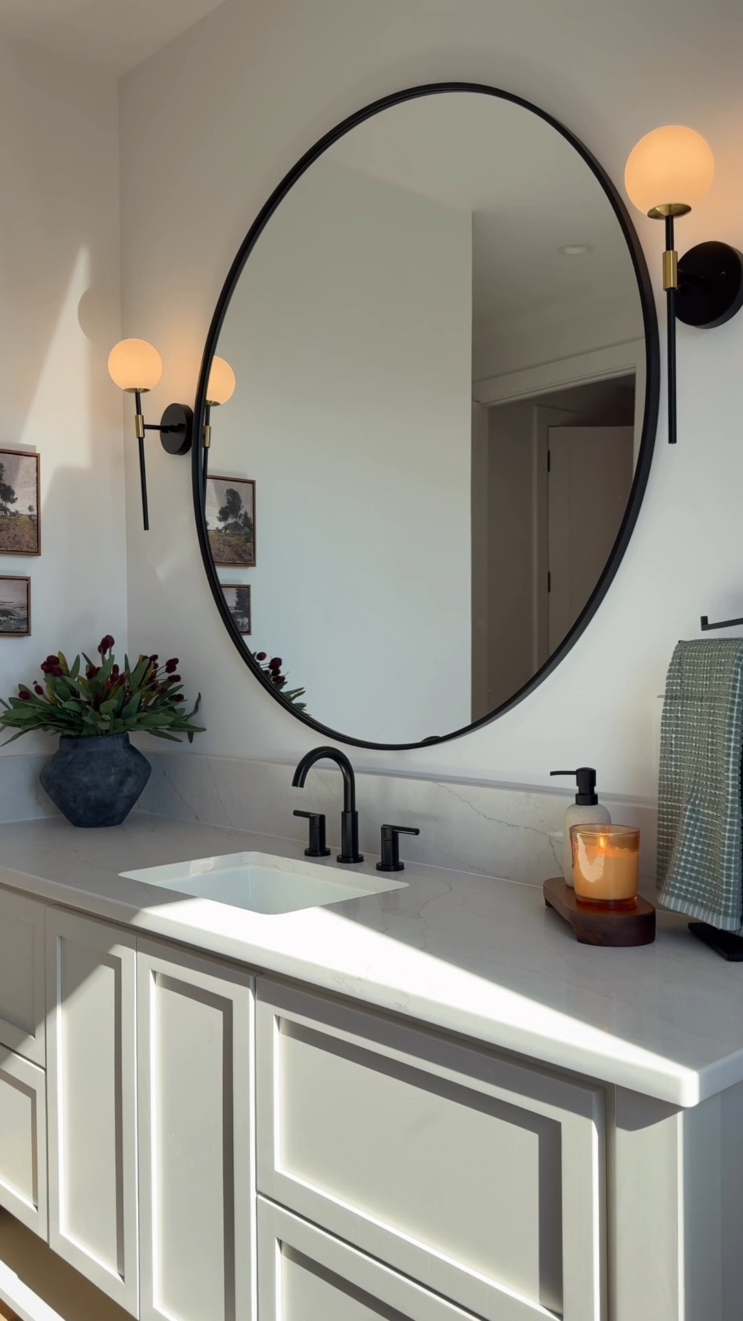 Simple bathroom styling ✨
 
guest bathroom, mirror, sconces, art, vase, stems, rug, washable, home decor 

#LTKHome
