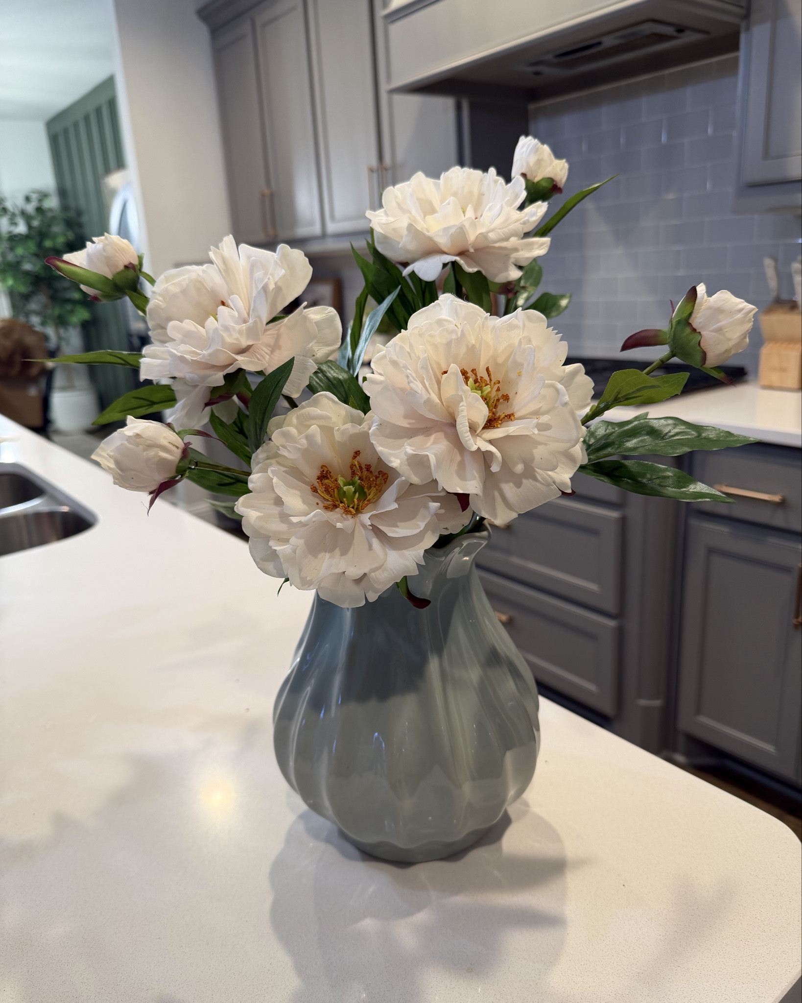 This Hearth and Hand pleated ceramic vase paired with the peony stems is one of my favorite easy styling combos. The soft blue vase adds just enough color, and the peonies look incredibly realistic in person.

I love how full the stems look without needing a ton of them, and the vase has that timeless shape that works year round. I styled this on my kitchen island, but it would look just as pretty on a dining table, console, or open shelving.

Such an easy way to refresh a space with pieces you’ll keep using season after season.

#LTKhome #LTKstyling #HearthAndHand #HomeDecor #NeutralHome

#LTKFindsUnder50 #LTKHome #LTKSeasonal