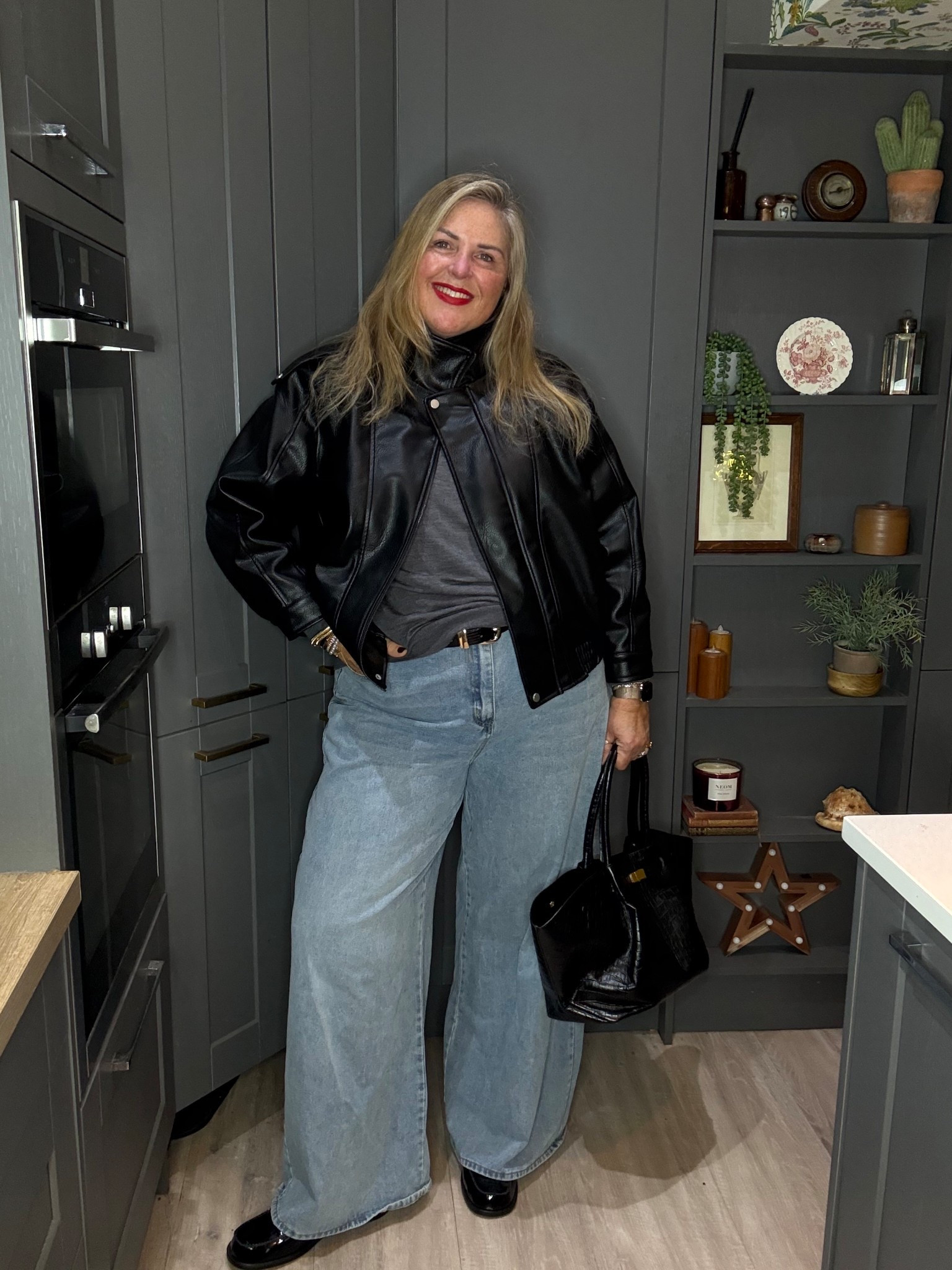 Faux leather jacket, grey jumper, palazzo jeans, black bag, black loafers 

#LTKcurves #LTKwinter #LTKplussize