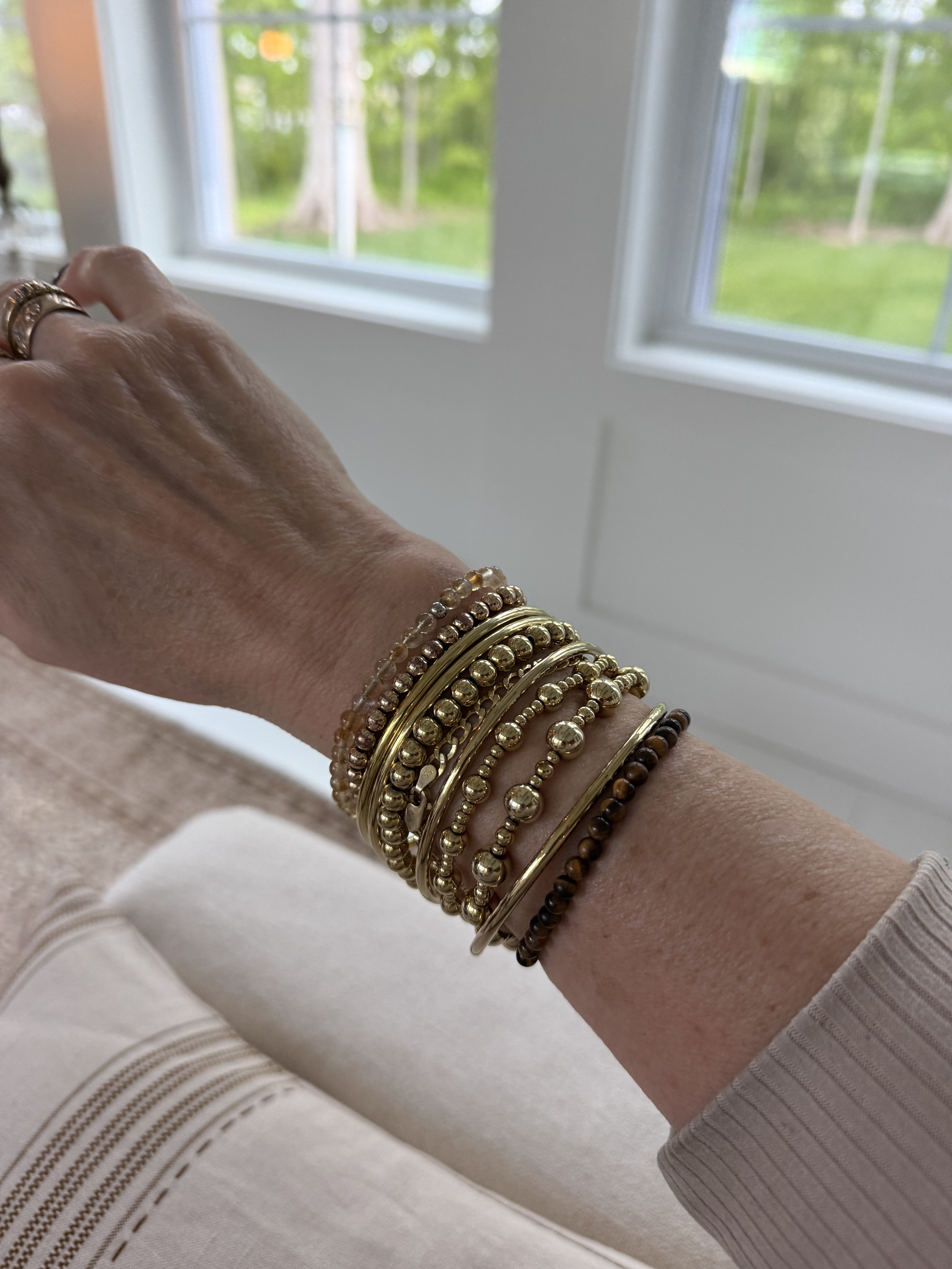 These are the bracelets and charms from @Amazon that I have been layering together.  

 #LTKootd