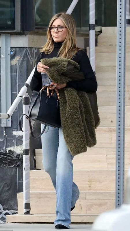 Shop Jennifer Aniston's chic look, front pocket flare jeans, black turtleneck sweater, black eyeglasses, top handle bag and toe boots @nordstrom #Nordstrompartner 

#LTKstyletip #LTKworkwear