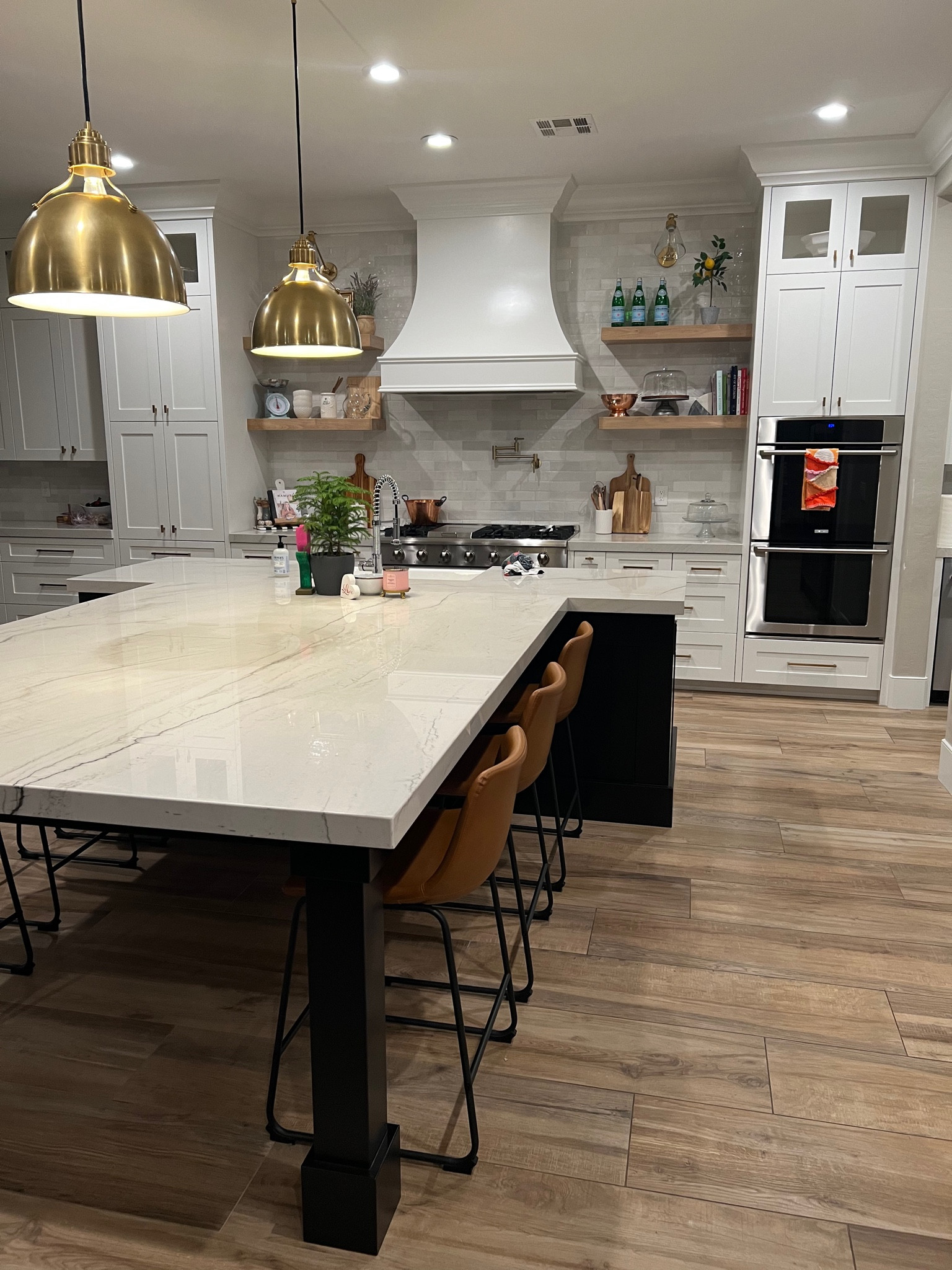Beautiful brass pendant lights for kitchen- we did medium, but available in large as well. Similar counter stools available in this same color. Barstool height available too. Cognac is the color

#LTKhome
