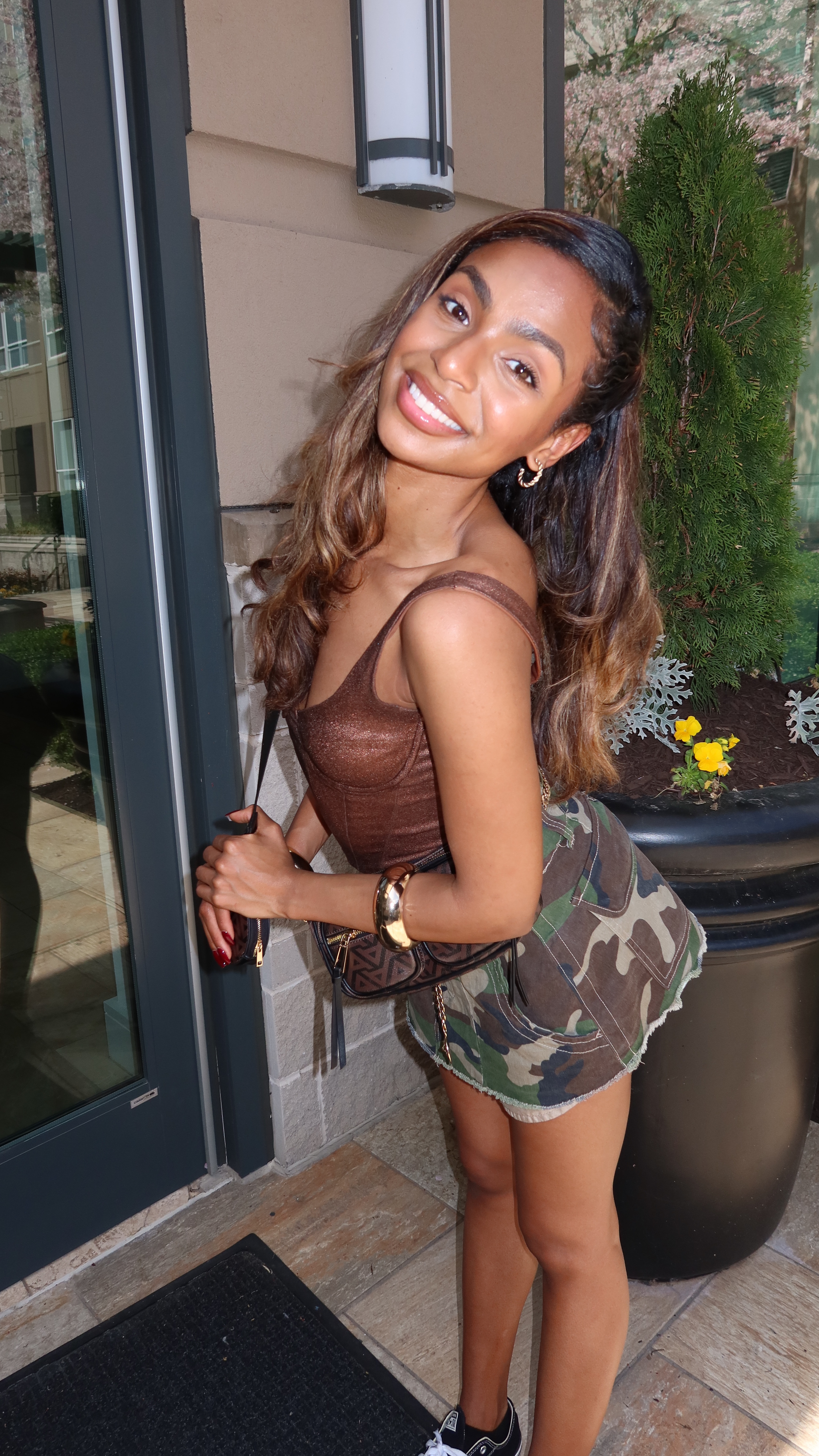 STYLED CASUAL SPRING OUTFIT 🌷 This casual spring outfit is the perfect mix of edgy and chic with a touch of effortless cool. The brown corset top hugs your figure beautifully, adding a structured and flattering element to the look. Paired with an army print mini skirt, it brings a bold, street-style vibe while keeping things fun and flirty. The black and white low-top Converse add a laid-back, classic touch, balancing out the structured top with a casual feel. Gold bangles bring a subtle hint of glam, complementing the brown and gold crossbody bag, which ties the whole outfit together with a polished finish. Perfect for a day out with friends or a stylish spring adventure, this look is both trendy and easy to wear.

For more fashion inspiration follow my fashion blog on Instagram! @niobymonroe

Spring outfits, spring outfits 2025, spring outfit ideas, spring outfits 2025 trends, spring outfits casual, spring outfits for women, spring outfits for school, spring fashion, spring fashion 2025, spring fashion outfits, spring fashion outfits 2025, spring fashion trends, army skirt outfit, army skirt, army skirt outfit black women, army skirt outfit ideas, army skirt ootd, army skirt ideas



#LTKStyleTip #LTKFindsUnder50 #LTKPetite