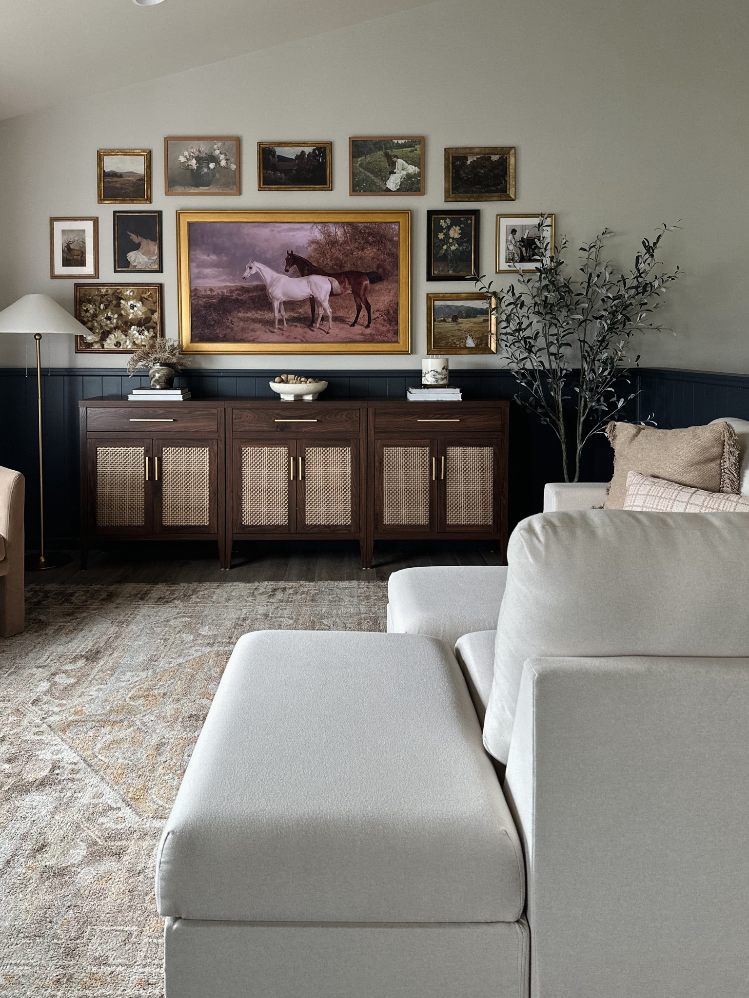 Loving the new cabinets in our living room! I pushed 3 together to make a large and affordable tv console!

Gallery wall, studio McGee home decor, target finds, target home decor, transitional home decor, 2 door cabinet, Sicotas cabinets, Amazon furniture, Amazon home decor, Amazon find, walnut cabinet, Samsung frame tv, brass frame tv frame, floral wall art, scenic wall art, portrait wall art, walnut cabinet, large media console, McGee and co, coffee table books, flameless marble candle, ceramic decor bowl, wooden decor beads, living room decor 

#LTKHome #LTKStyleTip