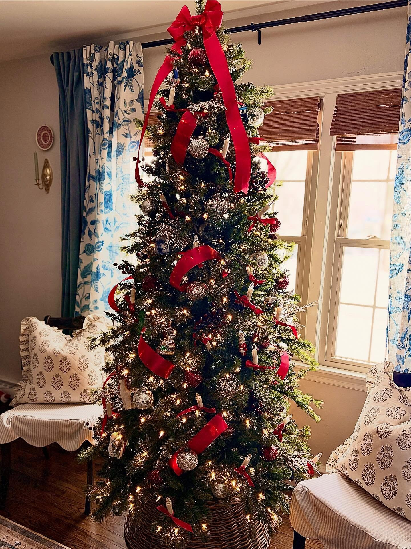 Behold- our new Christmas tree! We used to visit the tree farm and cut one down every year but a few years ago we made the transition to an artificial tree and I’m kind of in love with the symmetry of artificial trees. This one is still narrow but much fuller than our other tree. I tried a few things I’ve never done before, adding candles, berry picks and ribbon. I’m pleased with how she turned out and I’m surprisingly in love with how the scarlet red looks against the French blue. Definitely a win this year 🌲

#englishcottage #englishcottagestyle #cottage #cottagecoreaesthetic #cottagecorecommunity #cottagecoredream #cottagecorevibes #frenchcountry #frenchcountrystyle #christmastree #christmasdecor #traditionalhome #collectedhome #christmasdecorations🎄