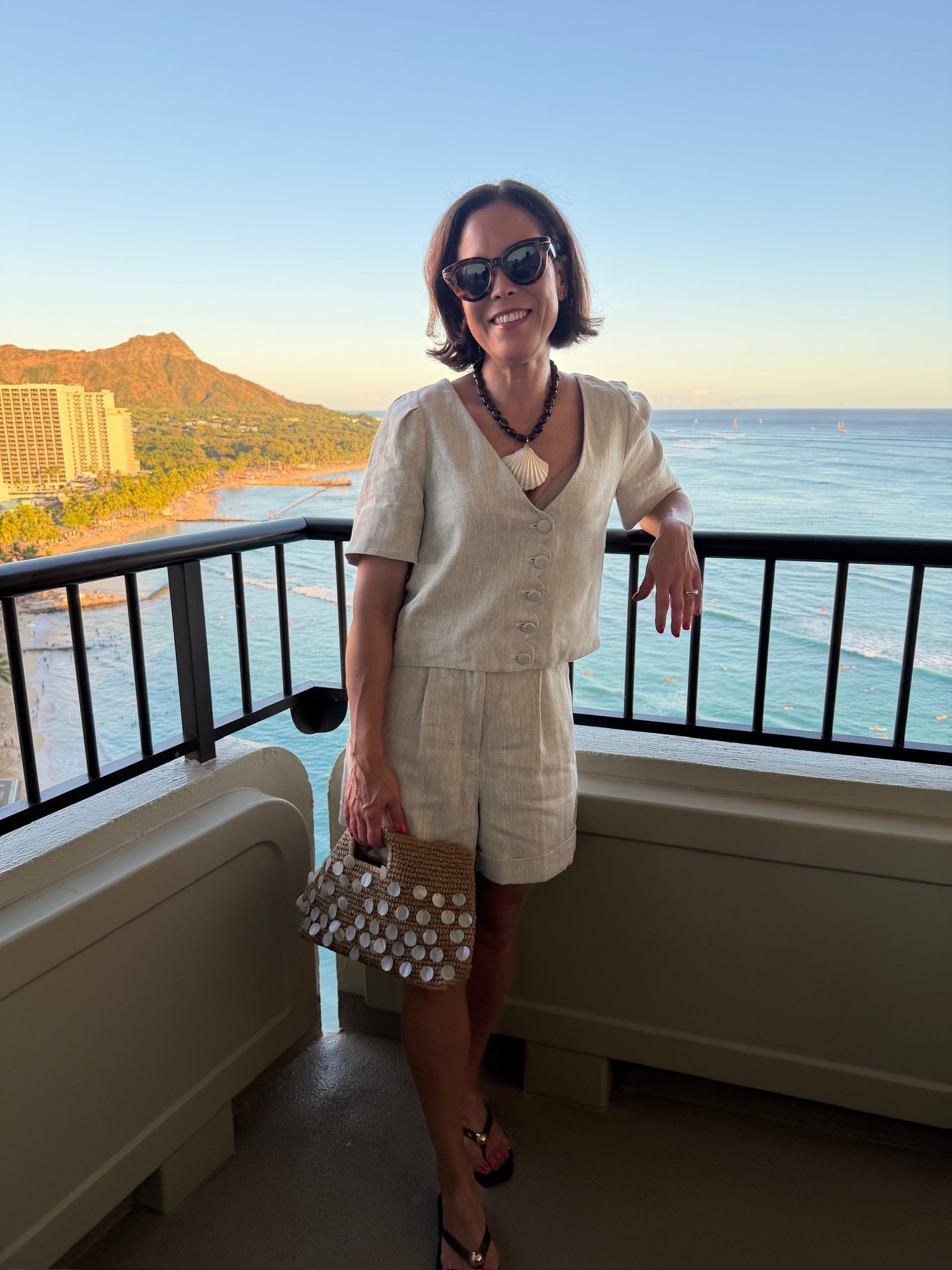 Dinner outfit in Hawaii: wearing Sezane shorts, top, and necklace. J.Crew shellbag, Loeffler Randall sandals (If you're between sizes, size up). Lipgloss color is REMIX

#LTKTravel #LTKootd