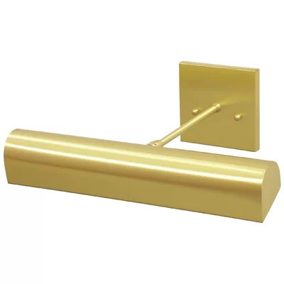 brass wired picture light over framed art