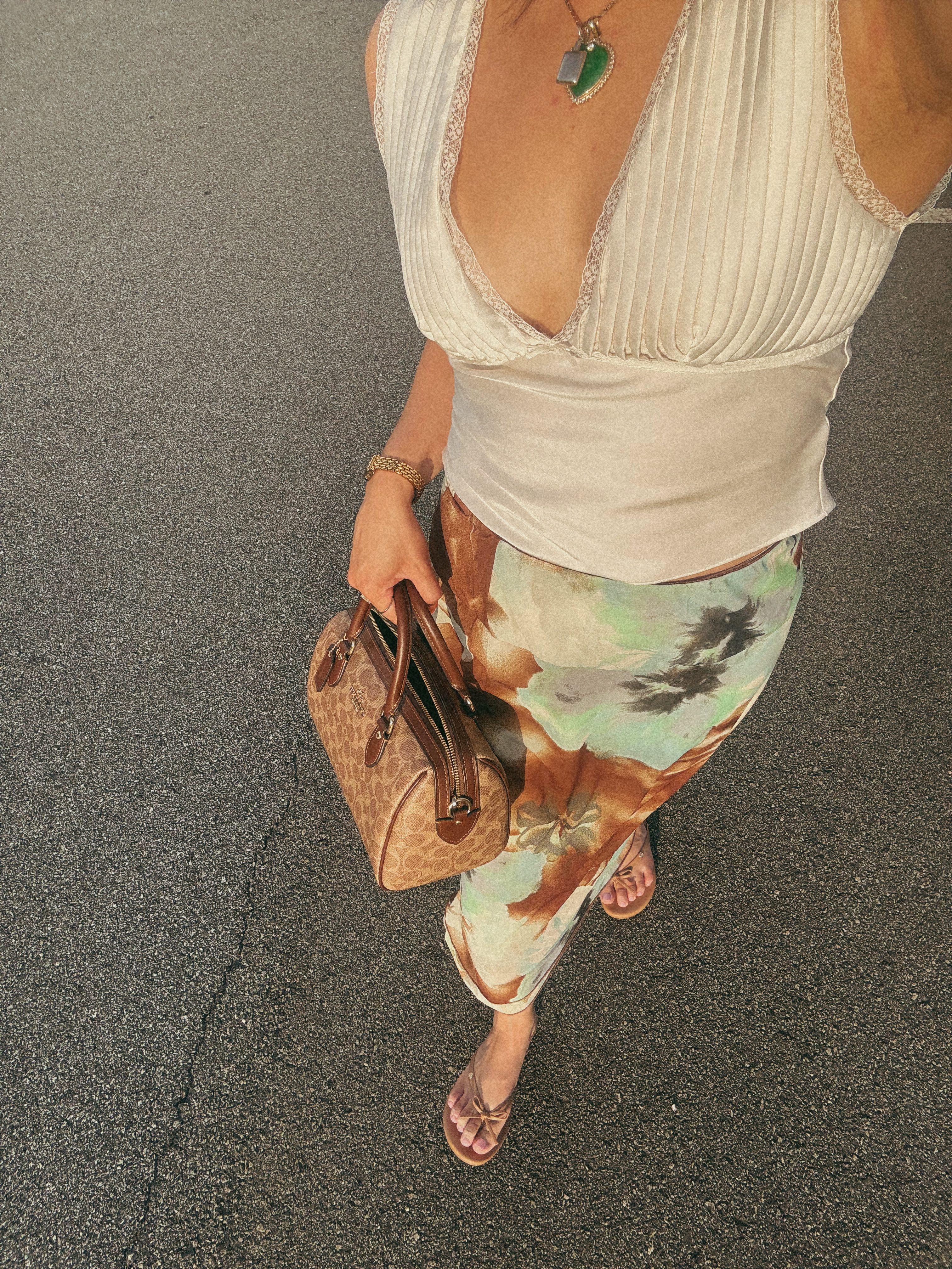 Channeling my main character energy in this dreamy fit 🌸🧊
Flowy skirt, silky top, and that Coach moment? Say less. #LTKStyle #OutfitInspo #ChicStyle #WhatIWore #SilkTop #FloralSkirt #StyleDiaries #LTKFinds #LTKUnder100 #FeminineStyle #LTKfashion #ModernFeminine 

 #LTKFindsUnder100 #LTKStyleTip #LTKItBag