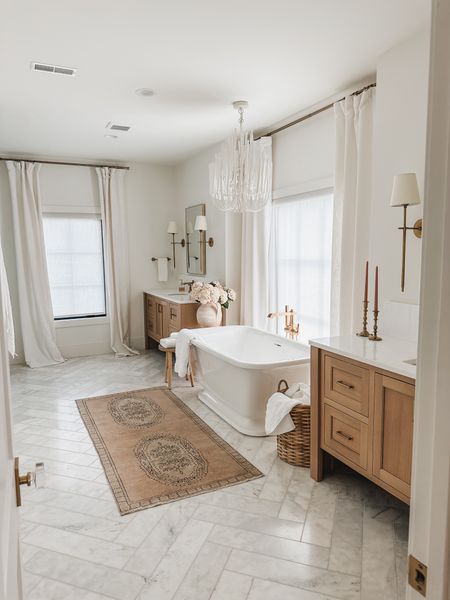 Light and bright primary bathroom with minimal elements, pops of pink faux florals, and vintage style rug

Bathroom refresh, light and bright, neutral style, vintage style rug, gold detail, wall sconce, faux florals, vase faves, woven basket, neutral wood tone, door knob detail, chandelier faves, tapered candle, curtain detail, gold hardware, shop the look!

#LTKStyleTip #LTKHome #LTKSeasonal