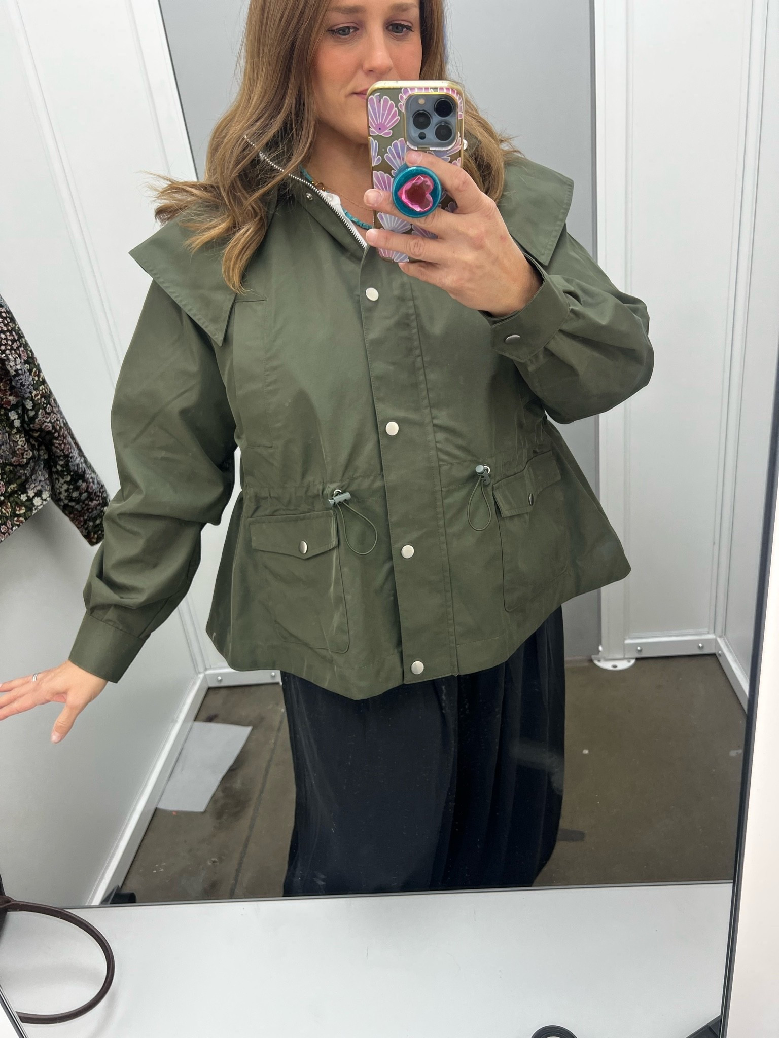 This jacket is absolutely incredible! Size down - I’m in a medium