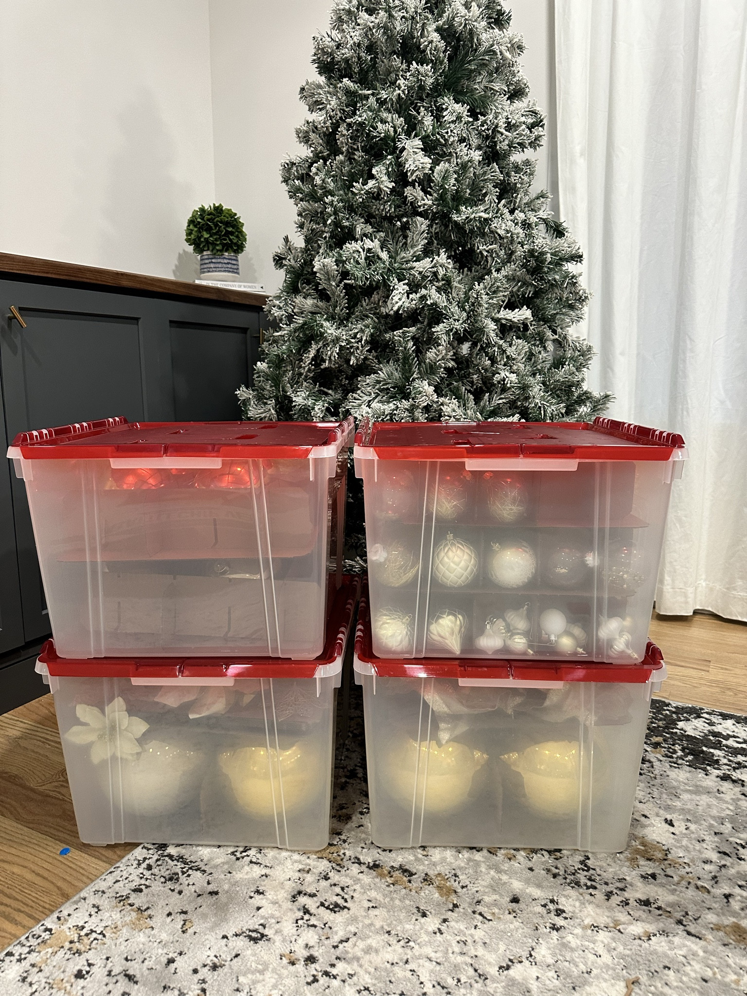 Packing up the Christmas tree! These ornament storage boxes are great for all your decorations. It comes with dividers that you can customize for small or large ornaments. I did a lot research and read reviews before buying these. It seemed like the plastic tubs held up much better and longer than the fabric ornament storage boxes. 

#LTKhome #LTKSeasonal