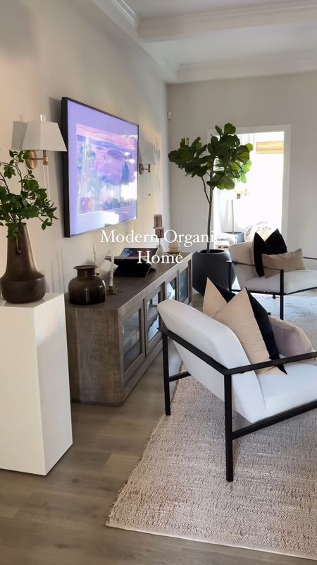 Modern organic living room ✨ I always get asked what my home decor style is and although I love a mix of so many different styles, modern organic has my heart

Home decor, living room decor, sunroom decor, sofa, couch, neutral, rug, light fixture, media cabinet, console, accent chair, decorative object, affordable 

#LTKHome #LTKStyleTip #LTKVideo