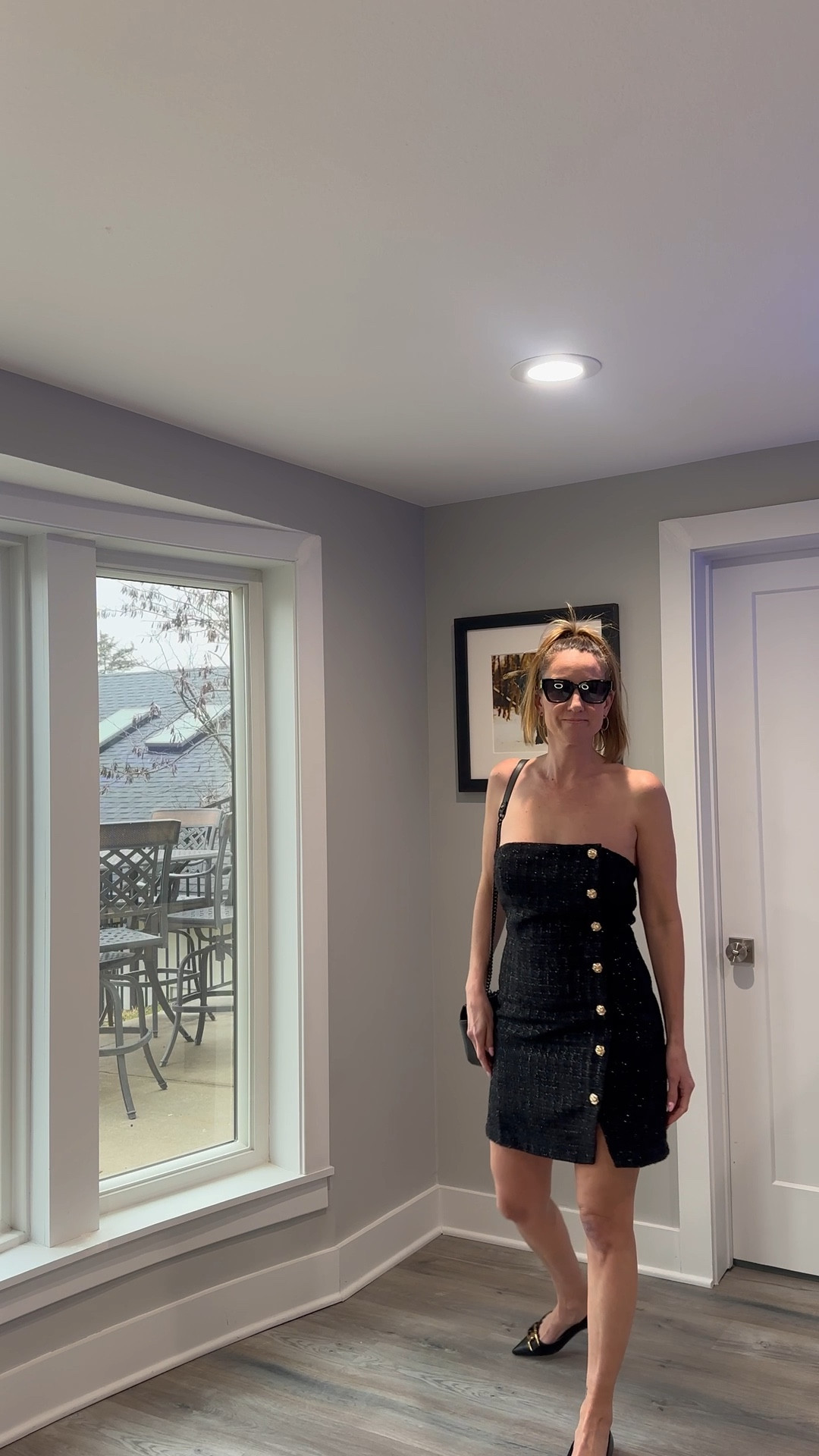 Every wardrobe needs a reliable statement dress that works for any occasion. 🌙🎀 This strapless tweed number is my go-to when I want to feel polished and powerful. Check out the link in my bio to shop this look and see more of my seasonal favorites! 🌟 #StyleInspo #BlackMiniDress #FormalFashion #ShopMyLook

My Little Black Dress Style Breakdown
• The Dress: I am wearing a strapless, mini-length black tweed dress.
• The Accents: The dress features a row of decorative gold buttons along the front and a small side slit.
• The Accessories: I’ve paired the outfit with a black quilted leather crossbody bag featuring a chain strap.
• The Eyewear: To complete the look, I added oversized black sunglasses for a touch of glamour.
• The Vibe: This ensemble is the definition of "modern elegance"—it is a sophisticated take on the classic LBD that is perfect for a sunset dinner or a night on the town.

Strapless black mini dress, black tweed dress, gold button detail dress, side slit mini dress, black quilted crossbody, oversized black sunglasses, cocktail party outfit, elegant evening wear, classic black dress style, LTKstyle

#LTKmomlife #LTKOver40 #LTKootd