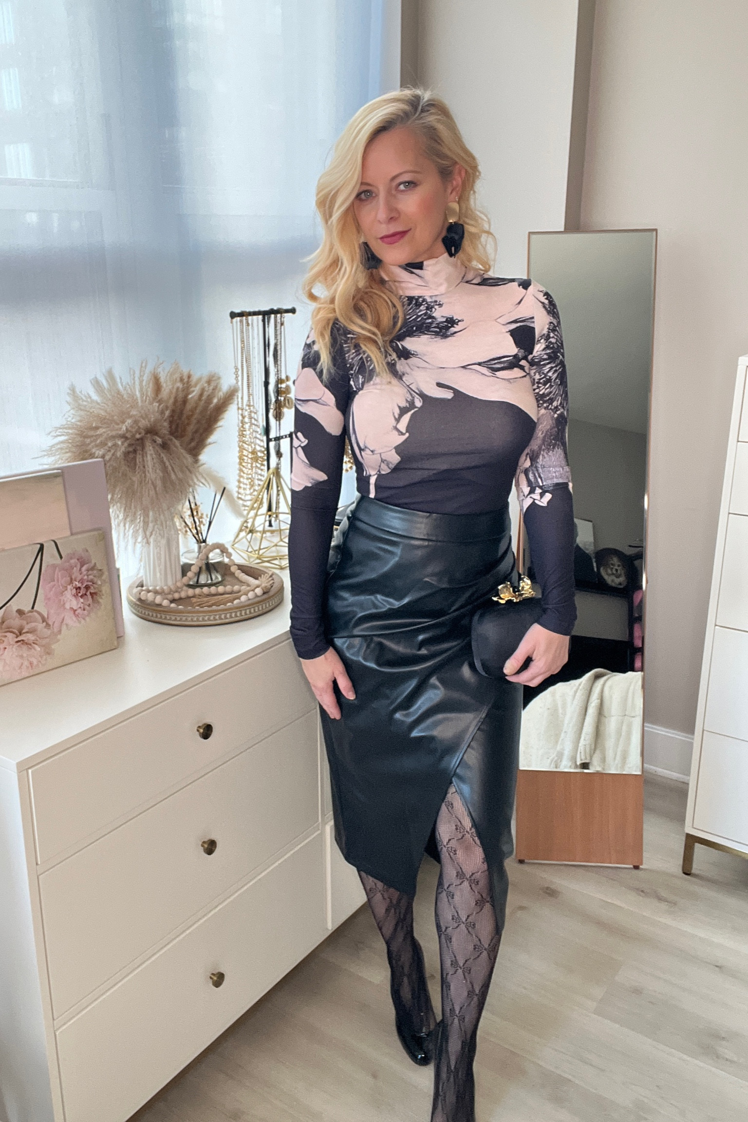 Cute date night outfit! Faux black leather skirt and print turtleneck, patterned tights  

#LTKOver40 #LTKStyleTip #LTKParties