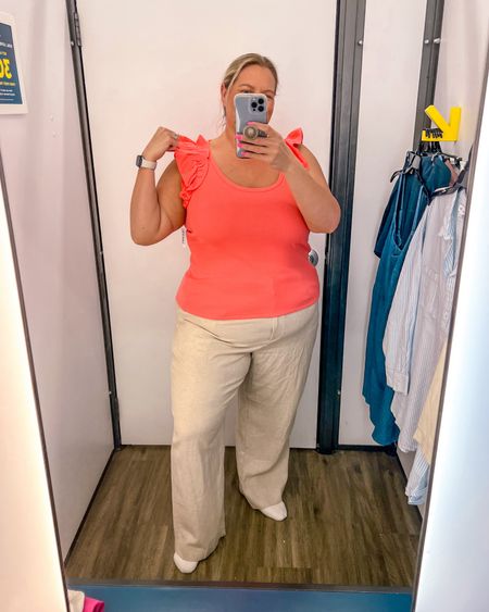 This coral colored tank with the perfect ruffle detail on the shoulder will be great for any spring or summer outfit. Also comes in several more cute colors. It paired great with these linen pants but also would be great with jeans, shorts, skirts, and more. 

#LTKplussize #LTKfindsunder50 #LTKSeasonal