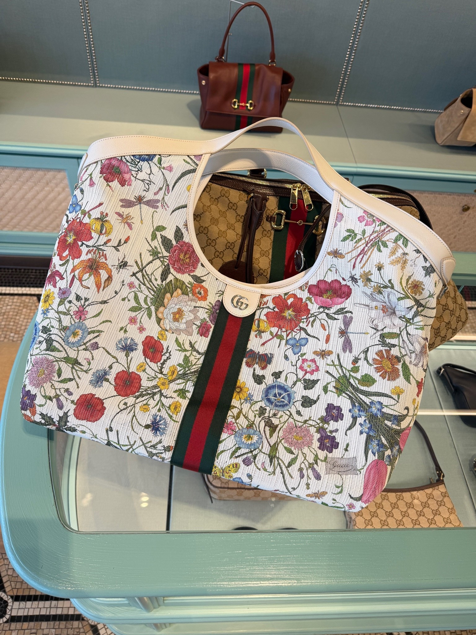 Summer bag, the mesh material makes this such a great mom bag to use for all the things. And cleans easily. I’ve taken it to the beach. It holds my laptop and my tennis racquet. I ordered an organizer off Amazon to put inside too. Has a wristlet that detaches you can use separately.