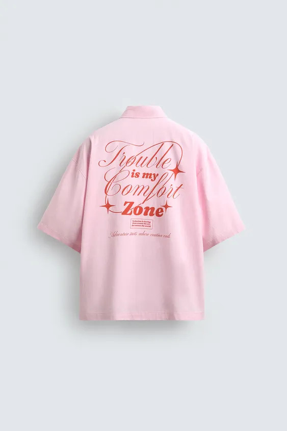 Boxy fit shirt made of lyocell and cotton blend fabric. Lapel collar and short sleeves. Contrasting text and graphic print at front and back. Front button closure. | Zara US