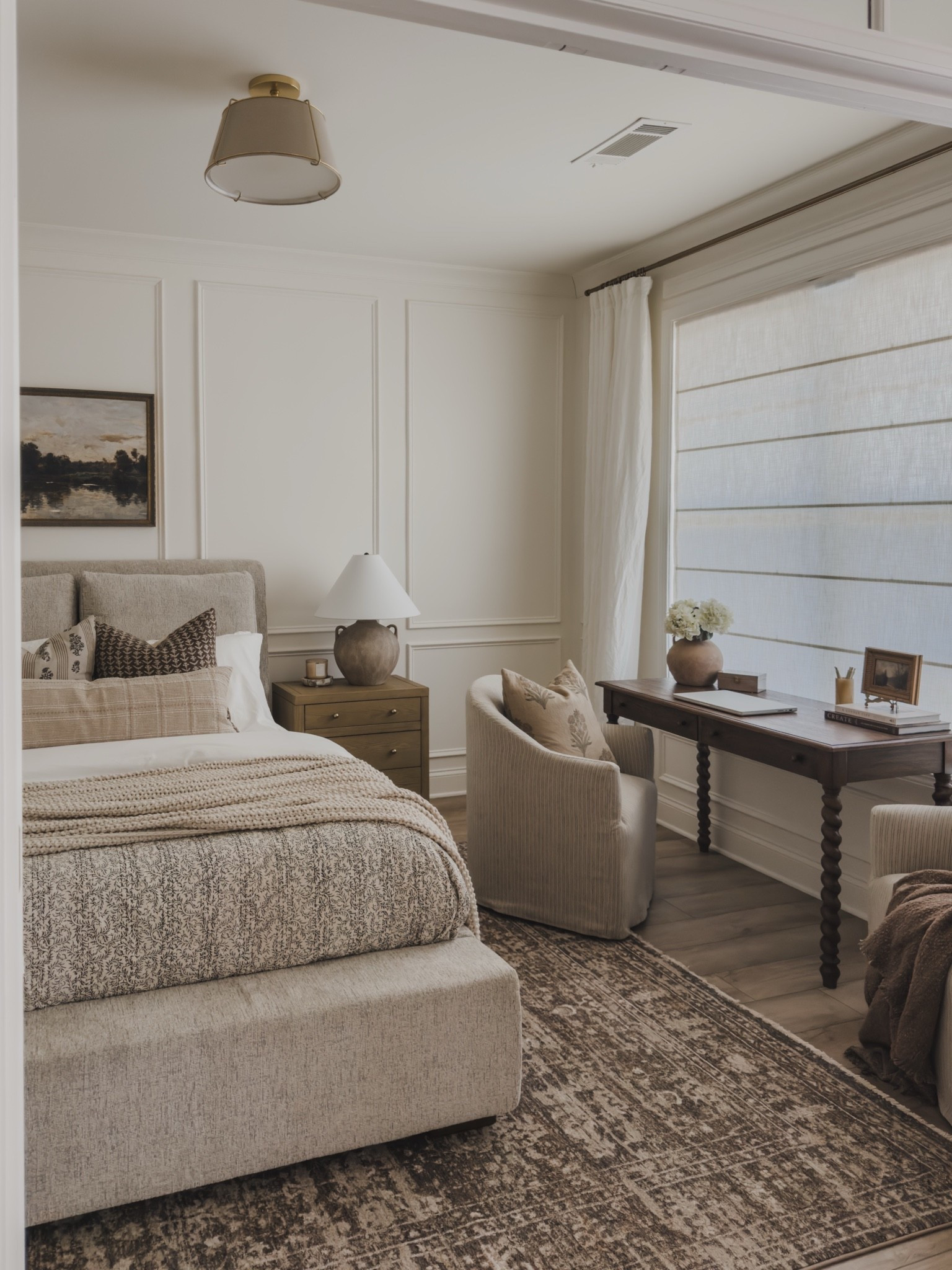 Bright and airy guest room views with a collected style. I utilized as much space in here as I could by adding a small yet functional desk with storage, a cozy chair, and a small seating area to maximize every corner of this room. 

Home finds, neutral home inspo, collected style, neutral wood tones, furniture favorites, timeless home inspo, guest bedroom refresh, linen details, upholstered bed frame, desk details, cozy accent chair, vintage inspired area rug, nightstand details, wainscoting detail, statement lighting, Ashley furniture, Greenrow, Loloi, Amber Lewis, Kathy Kuo Home, Pottery Barn style, Two Pages, Wayfair, Four Hands, shop the look!

#LTKSeasonal #LTKHome
