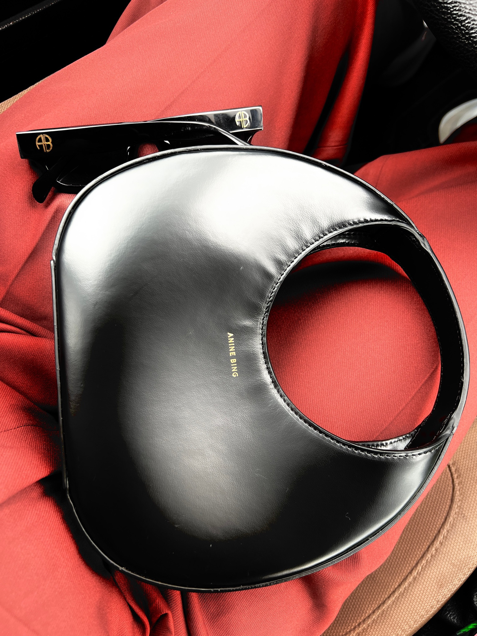 Black mini bag by Anine Bing and black rectangular sunglasses  

#LTKworkwear #LTKitbag #LTKstyletip