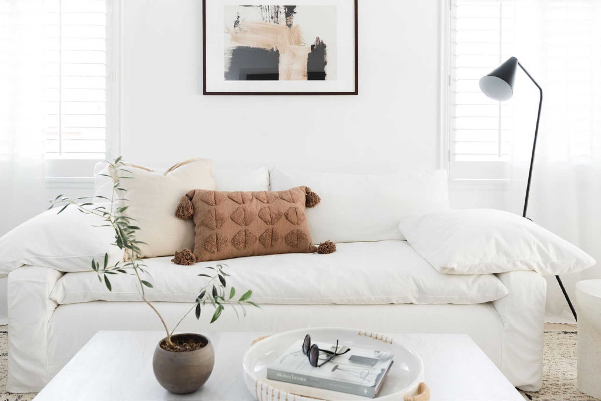 Living room with texture and accent colors. Wall art, throw pillow, sofa, wooden coffee table, black floor lamp, black accent chair, side table, linen curtains, and area rug.

Home decor, living room decor, living room style, living room decor, couch, coffee table, living room rug, family room decor, family room styling. 

#LTKhome #LTKstyletip #LTKfamily