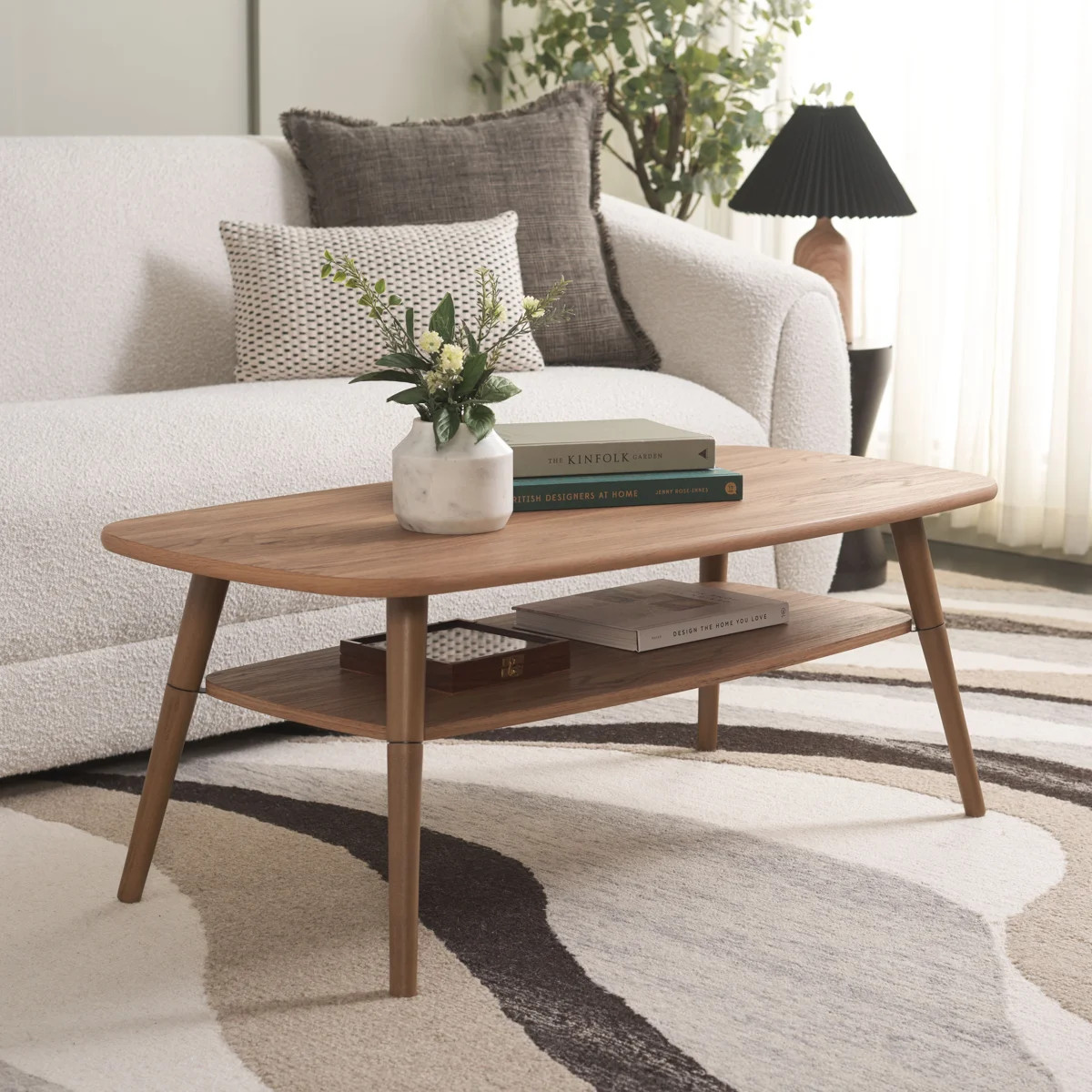 Ready to hold or display a variety of items, this coffee table brings mid-century modern style to... | Wayfair North America