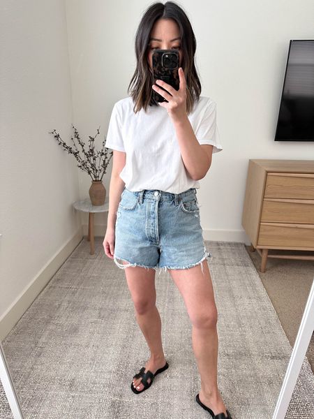 AGOLDE Dee denim shorts. These are the ones I wear now. Leg opening isn’t crazy big. And longer length for  mom life. 

Color: Muse
Inseam: 3”
Size 26
Runs really small, sized up 2 sizes. 

Tee - Everlane medium 
Sandals - Hermes 35

#LTKstyletip #LTKunder100